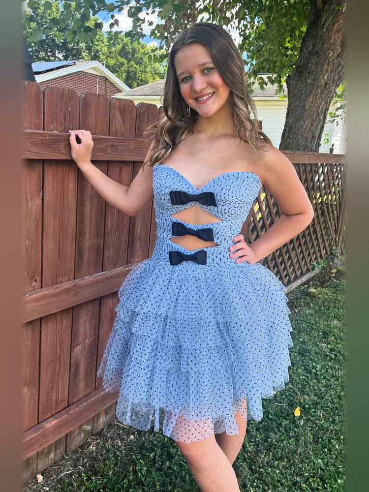 Blue mini tulle dress with sweetheart neckline and black bow cutouts, flared full skirt