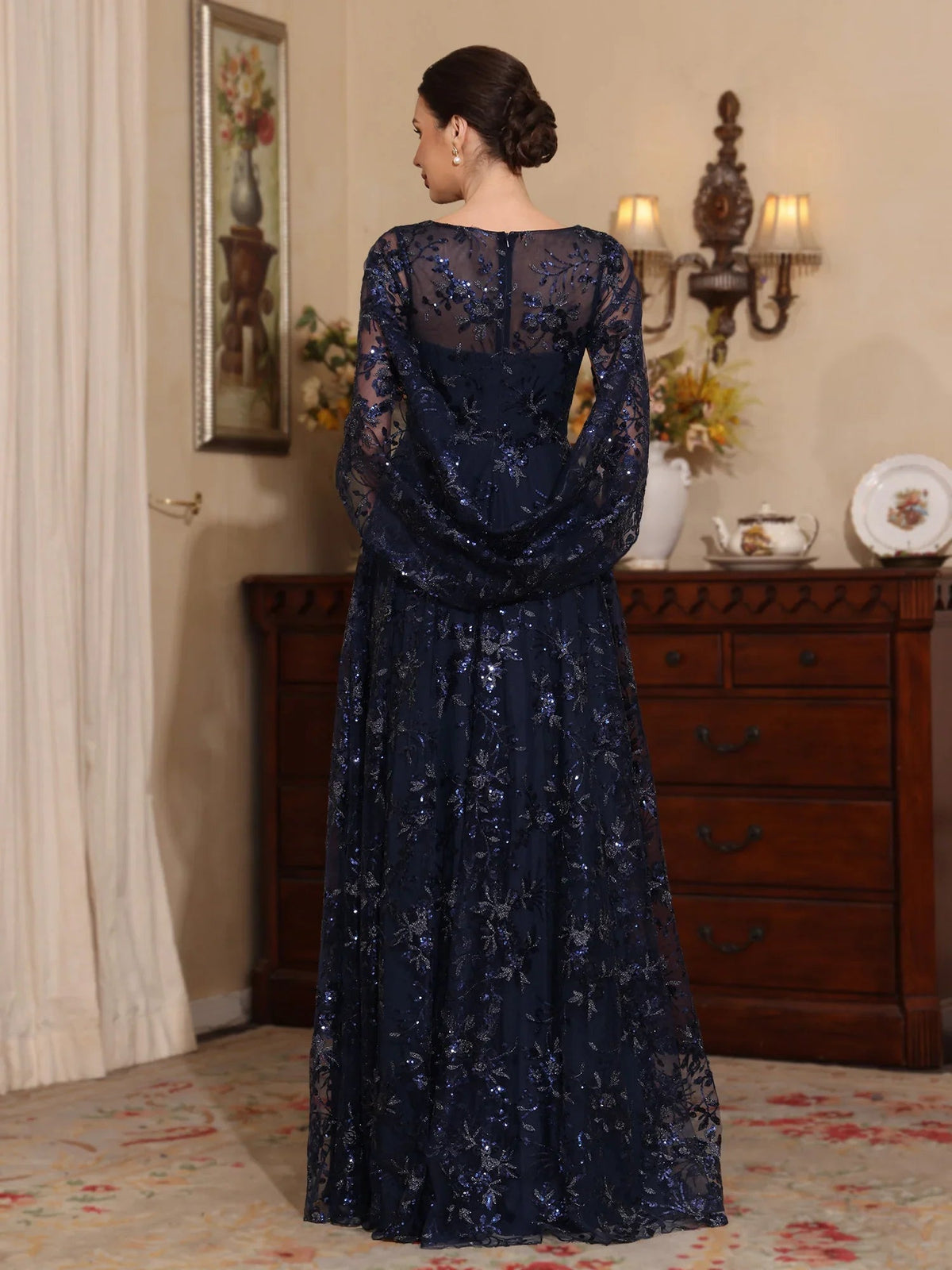 Dark navy tulle A-line gown with floral embroidery, lace illusion back and long sleeves