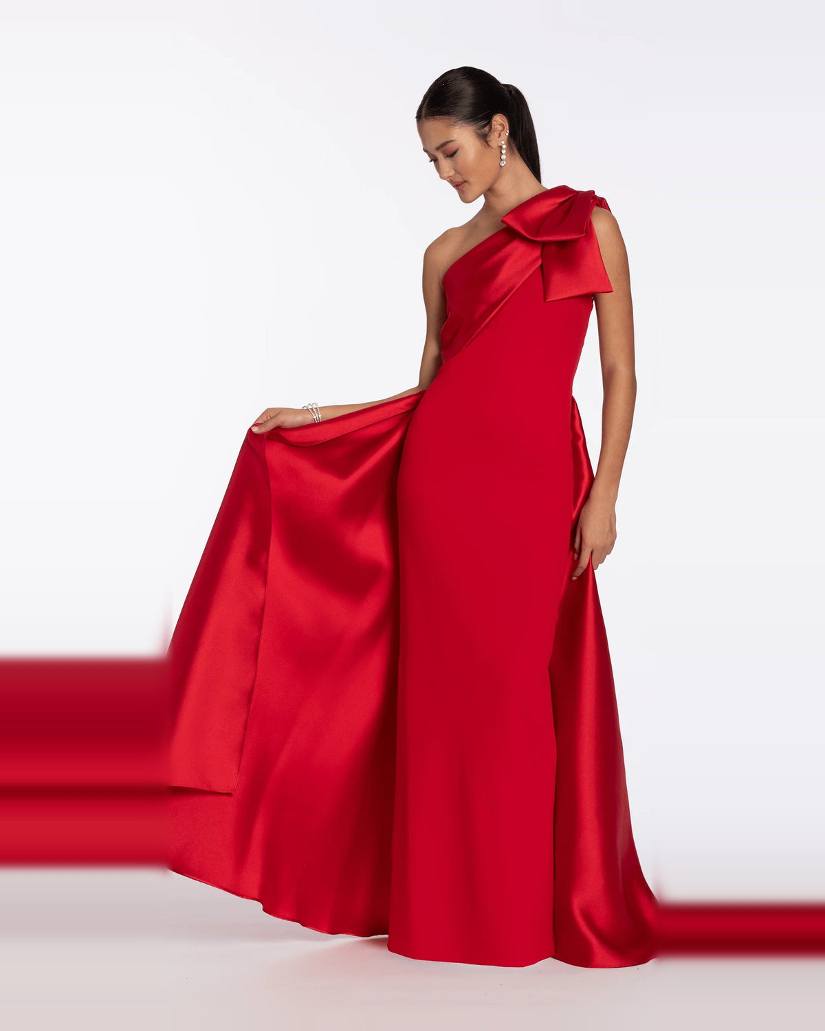Red satin-look one-shoulder column maxi dress with oversized bow and long side slit