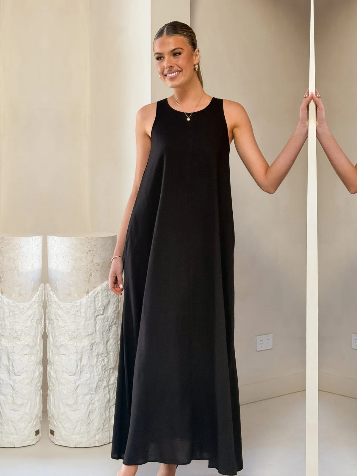 Black a-line maxi formal dress with a-line, alternate view showing the waist