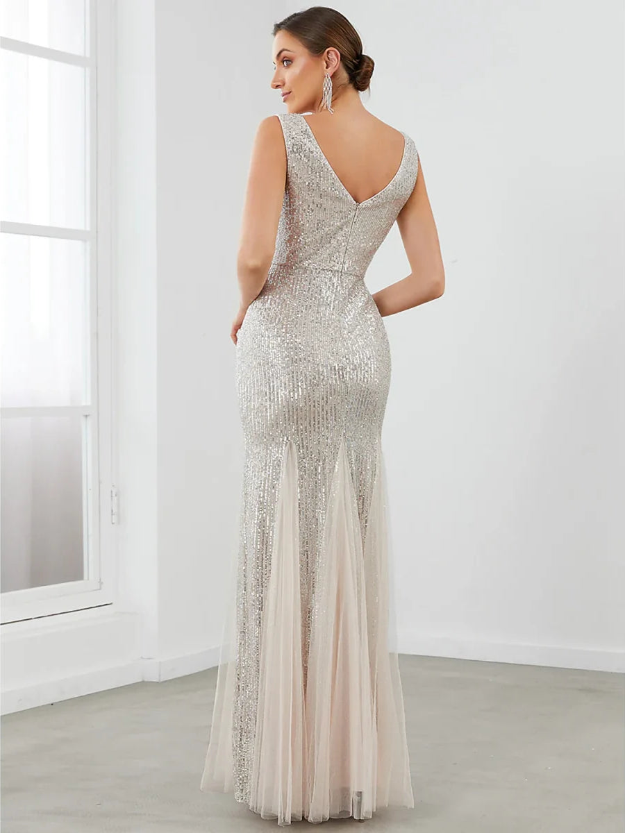 Silver sequin sleeveless formal dress with V-back and sheer mermaid skirt
