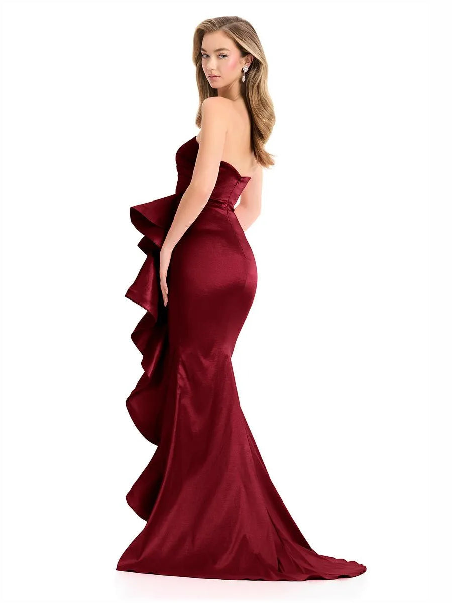 Burgundy strapless floor-length gown with ruching and layered side ruffles