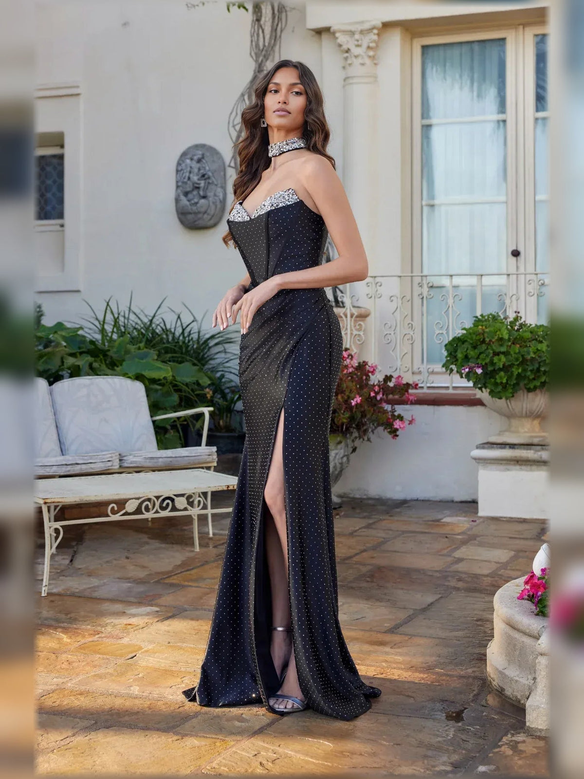 Black polka-dot sweetheart corset gown with sparkling trim and high side slit