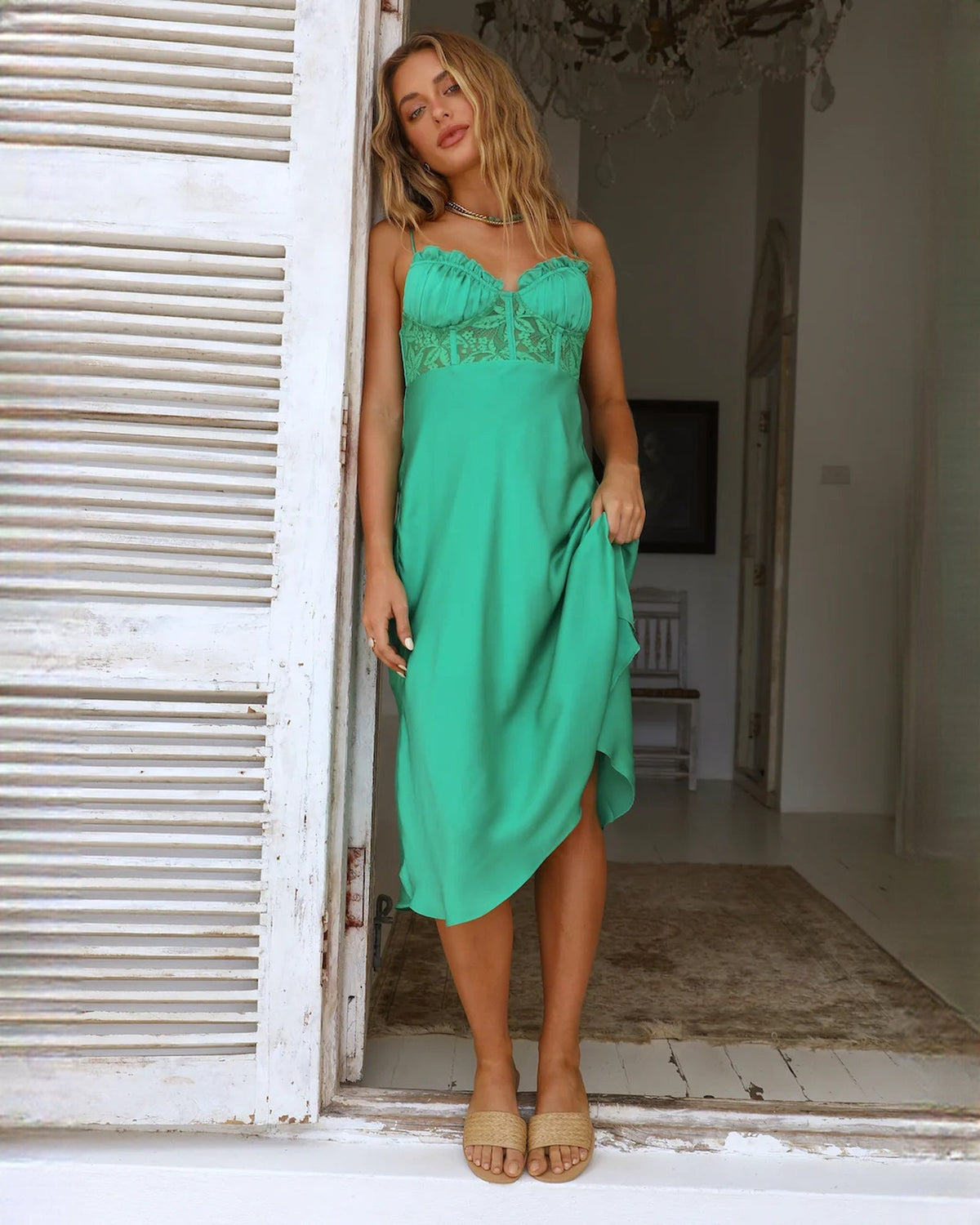 Mint green sleeveless satin midi dress with lace-textured ruched bust and side drape