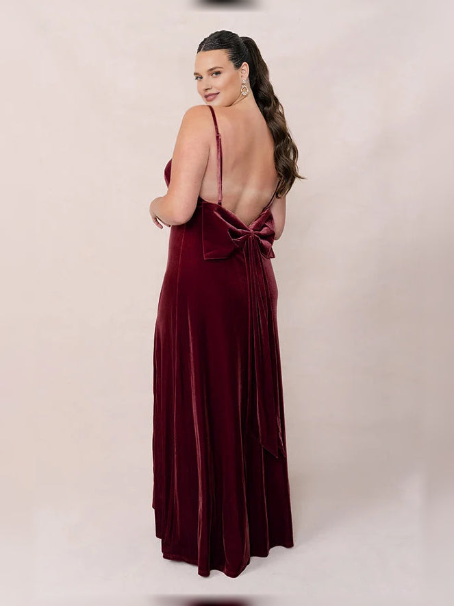 Burgundy velvet bridesmaid dress with open back and tied bow detail