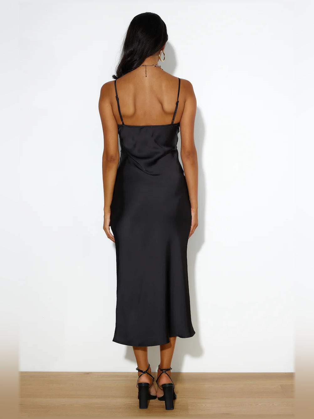 Black midi formal dress with open-back straps and draped cowl back detail