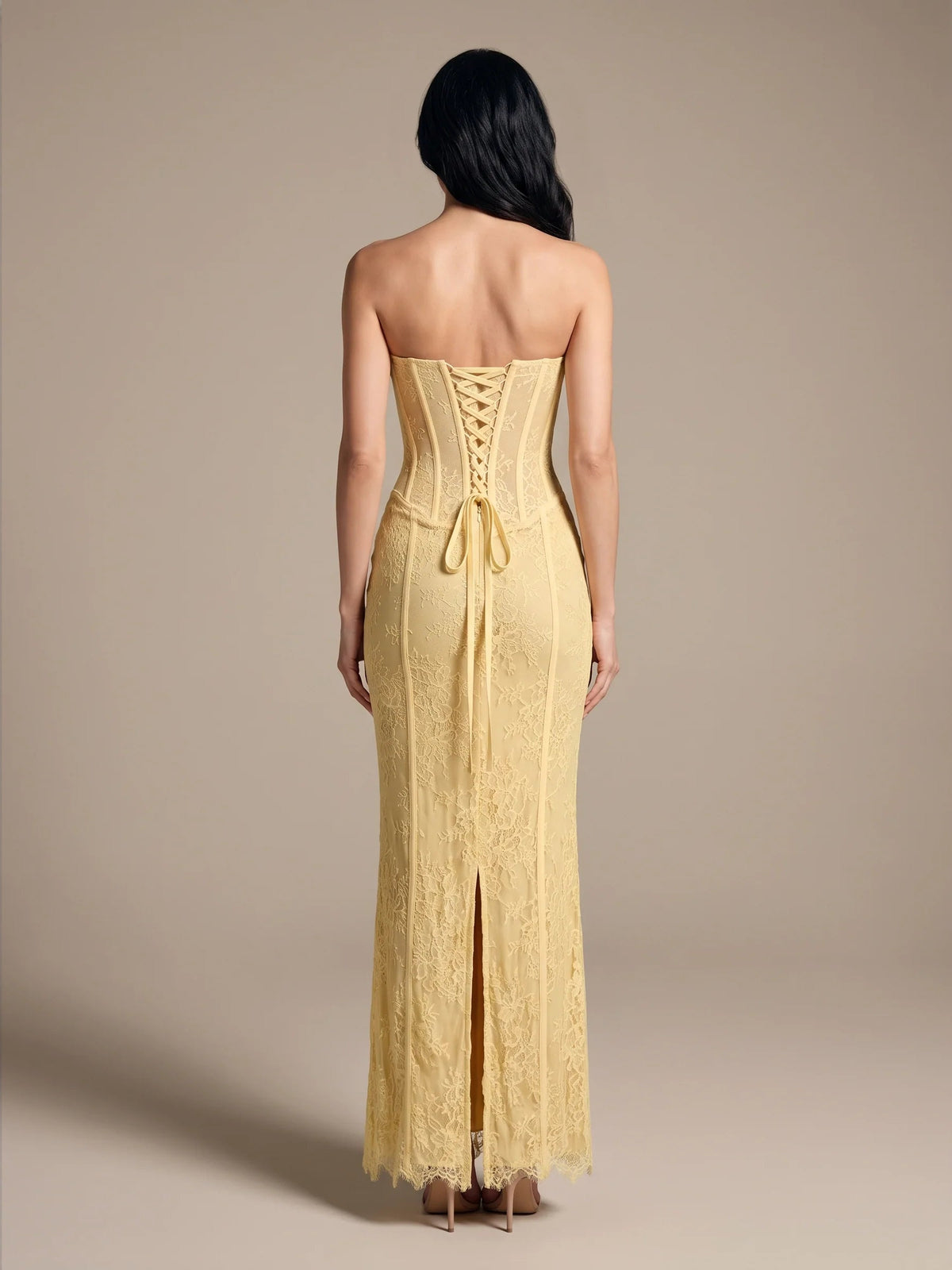 Pale gold open-back corset mermaid gown with lace texture and floor length slit