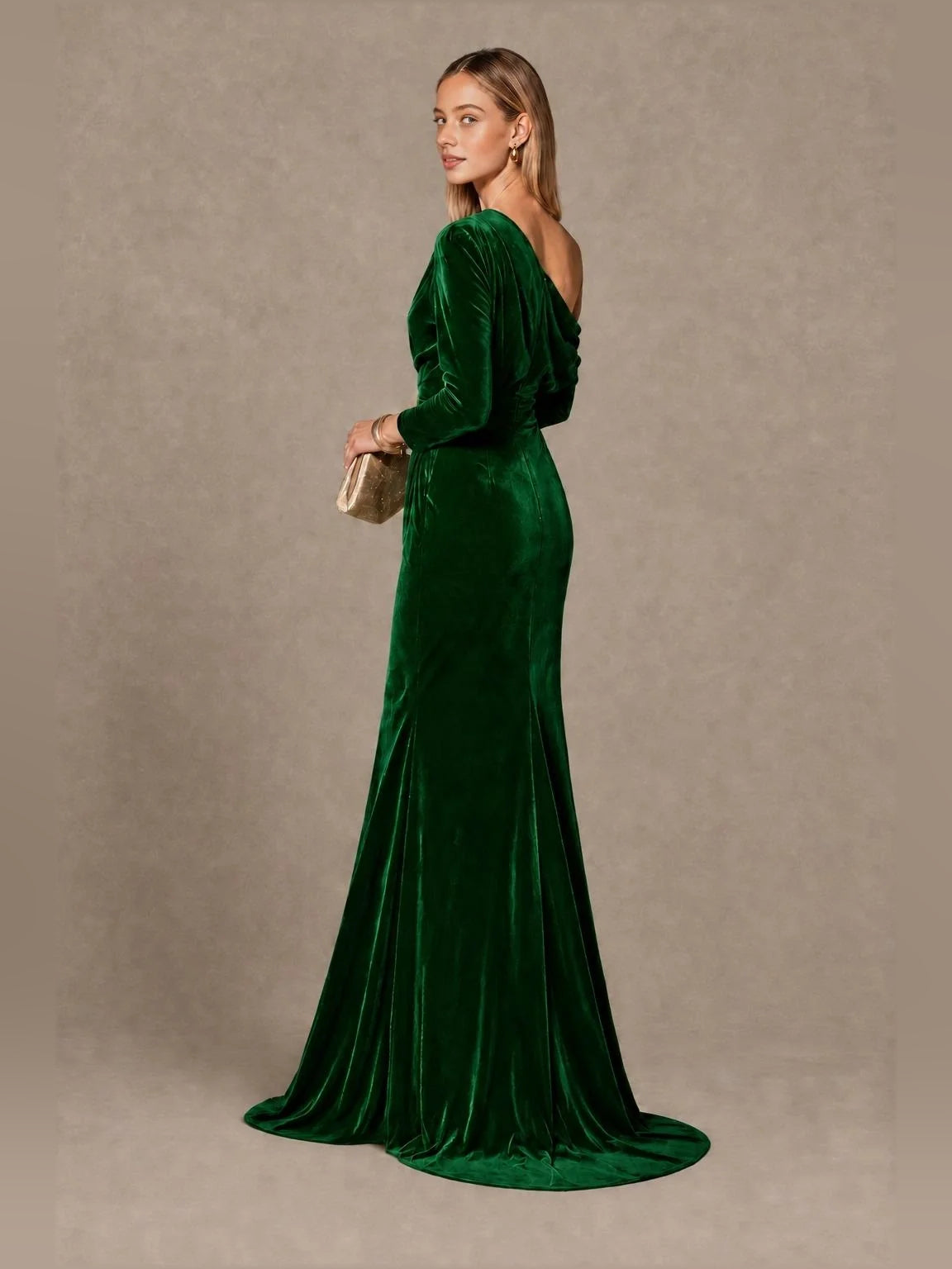Emerald green velvet one-shoulder mermaid gown with draped bodice and long sleeve