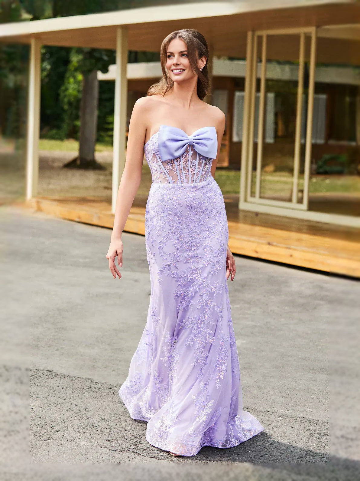 Lilac strapless mermaid prom dress with lace texture and oversized bow at the bust