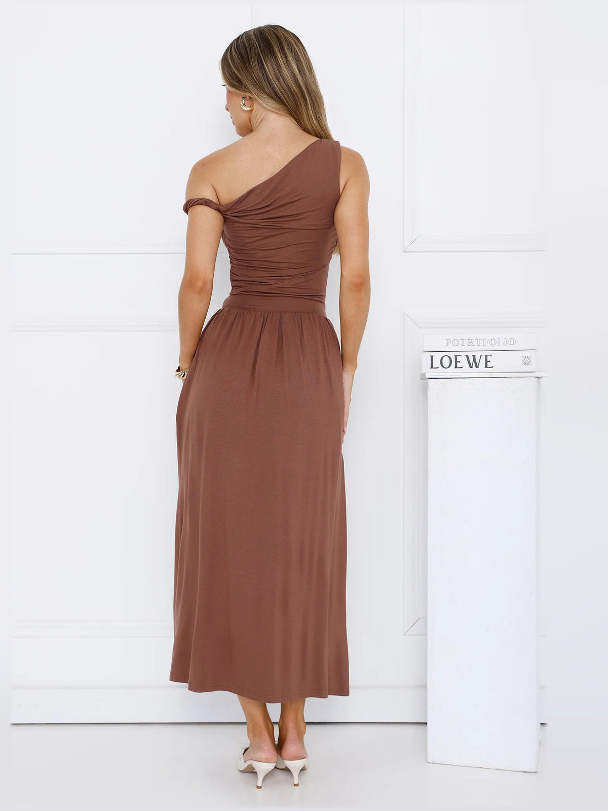 Brown off-shoulder midi dress back view with draped bodice and gathered skirt