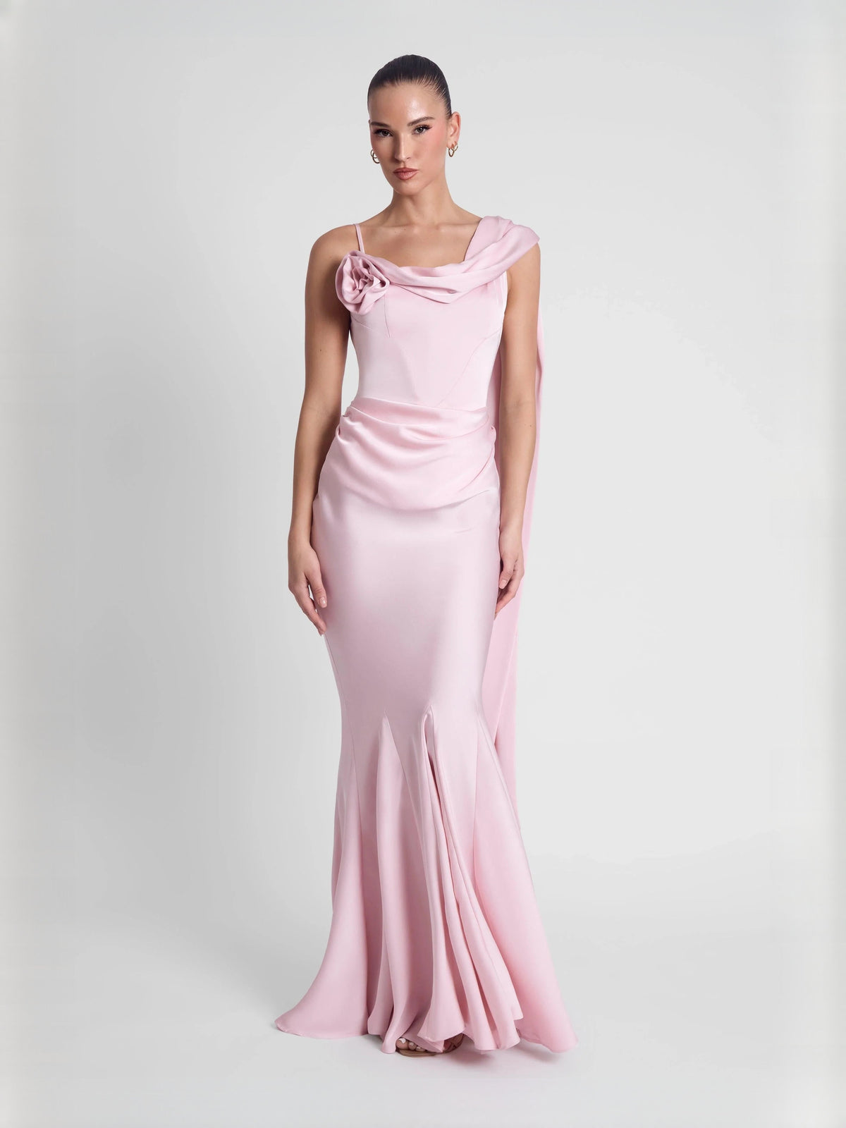Pink mermaid formal dress with draped off-shoulder neckline and subtle rosette detail