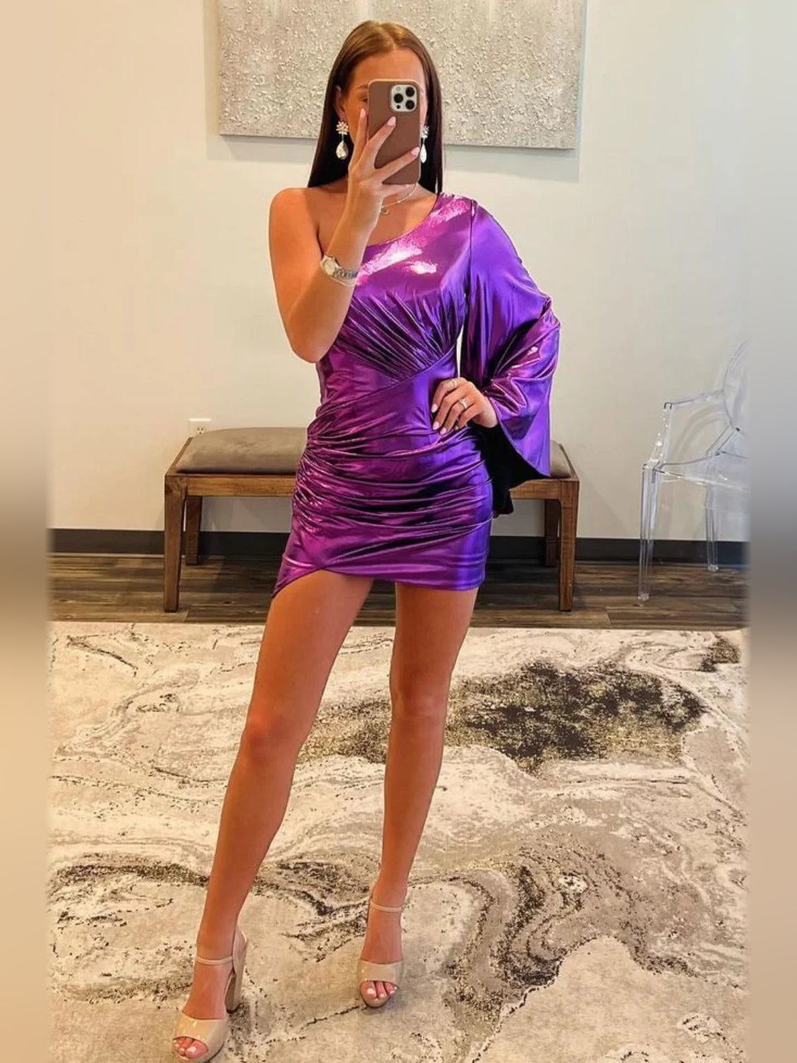 Purple one-shoulder ruched bodycon mini dress with draped sleeve and metallic sheen