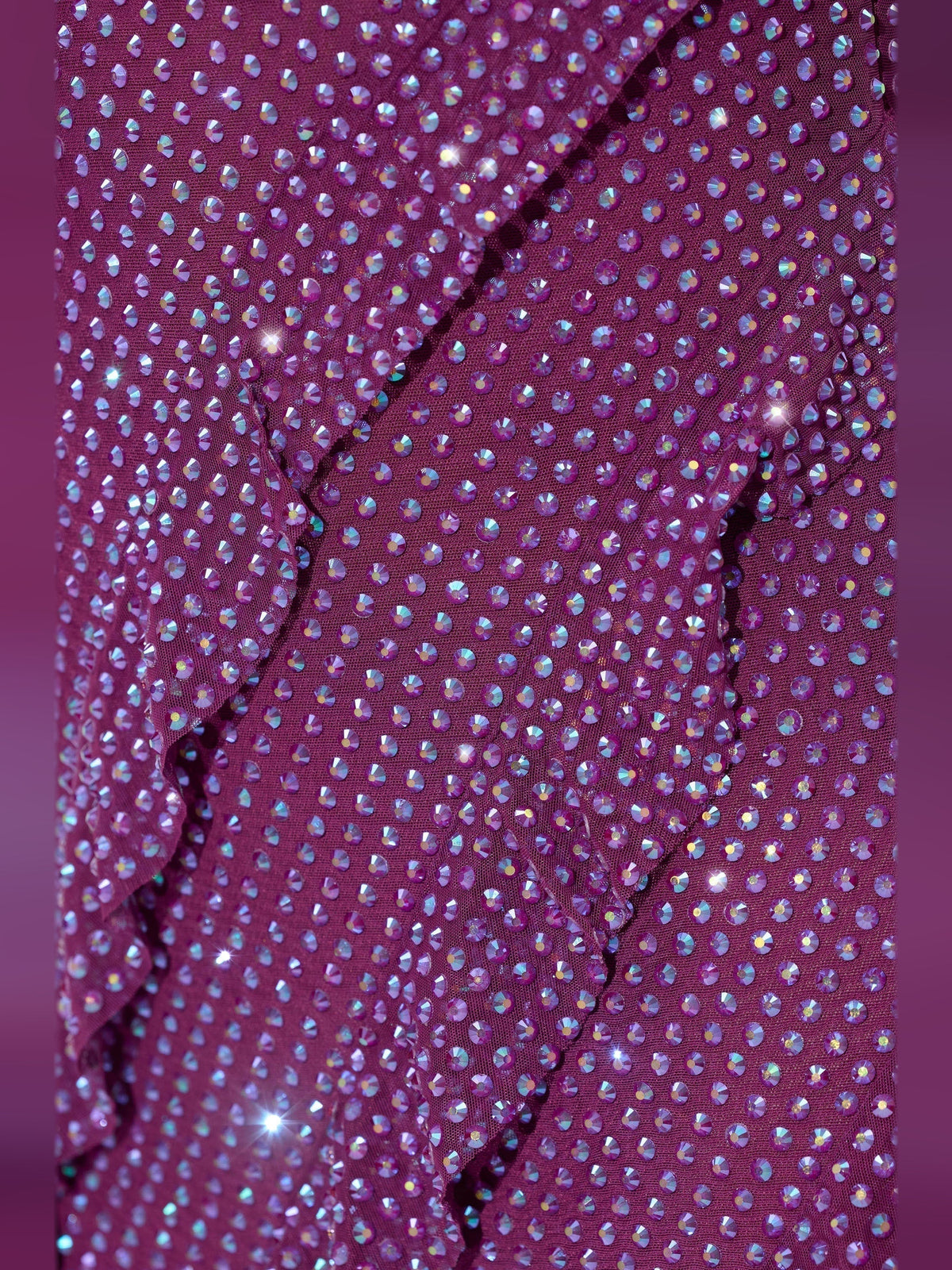 Plum mini dress fabric detail with sparkling dotted embellishment and ruffle seams