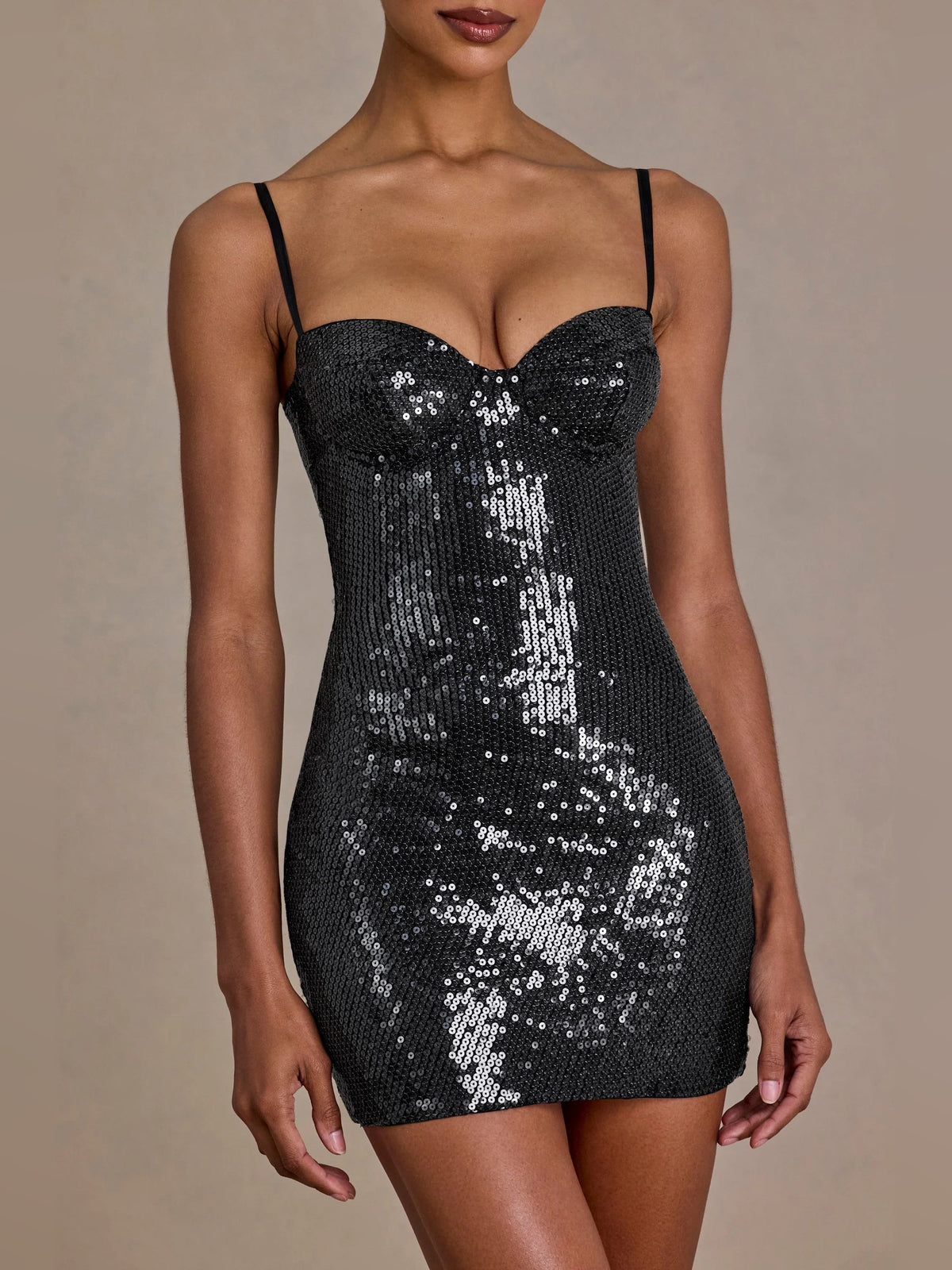 Black sequin corset mini dress with sweetheart bust and thin spaghetti straps, close-up