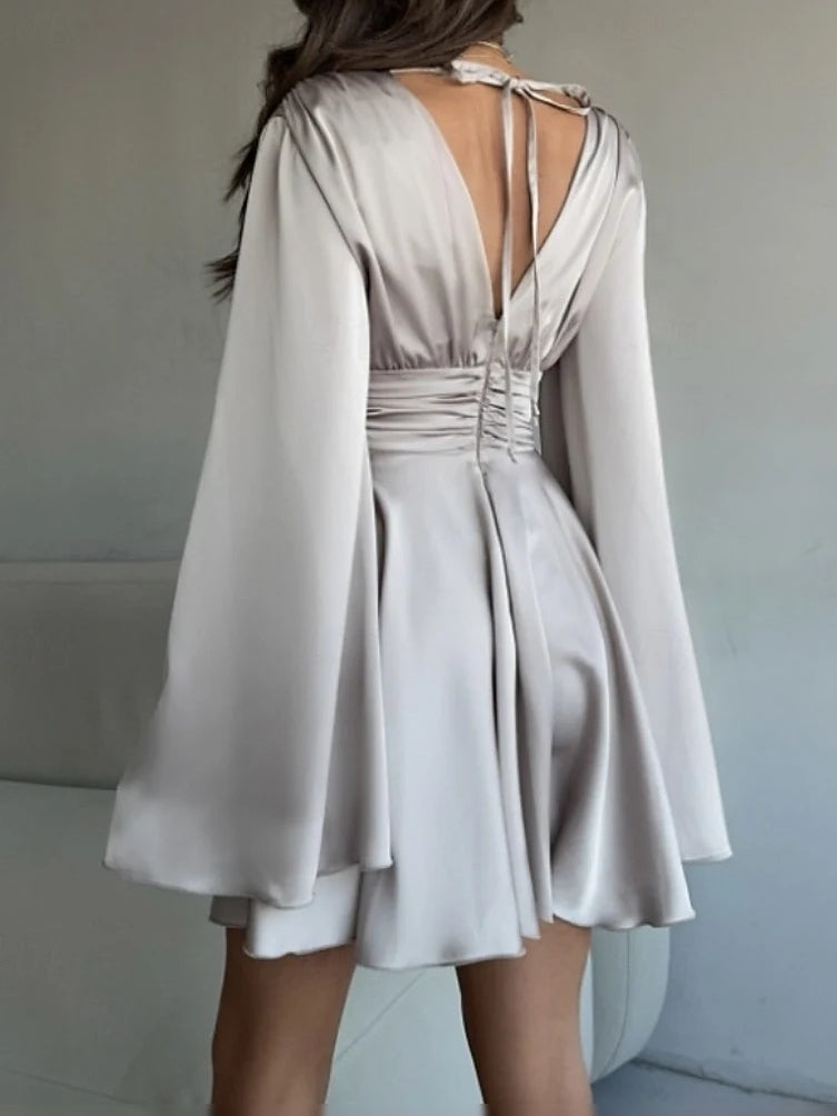 Ivory satin mini prom dress with ruched V-neck, open back, and flared skirt