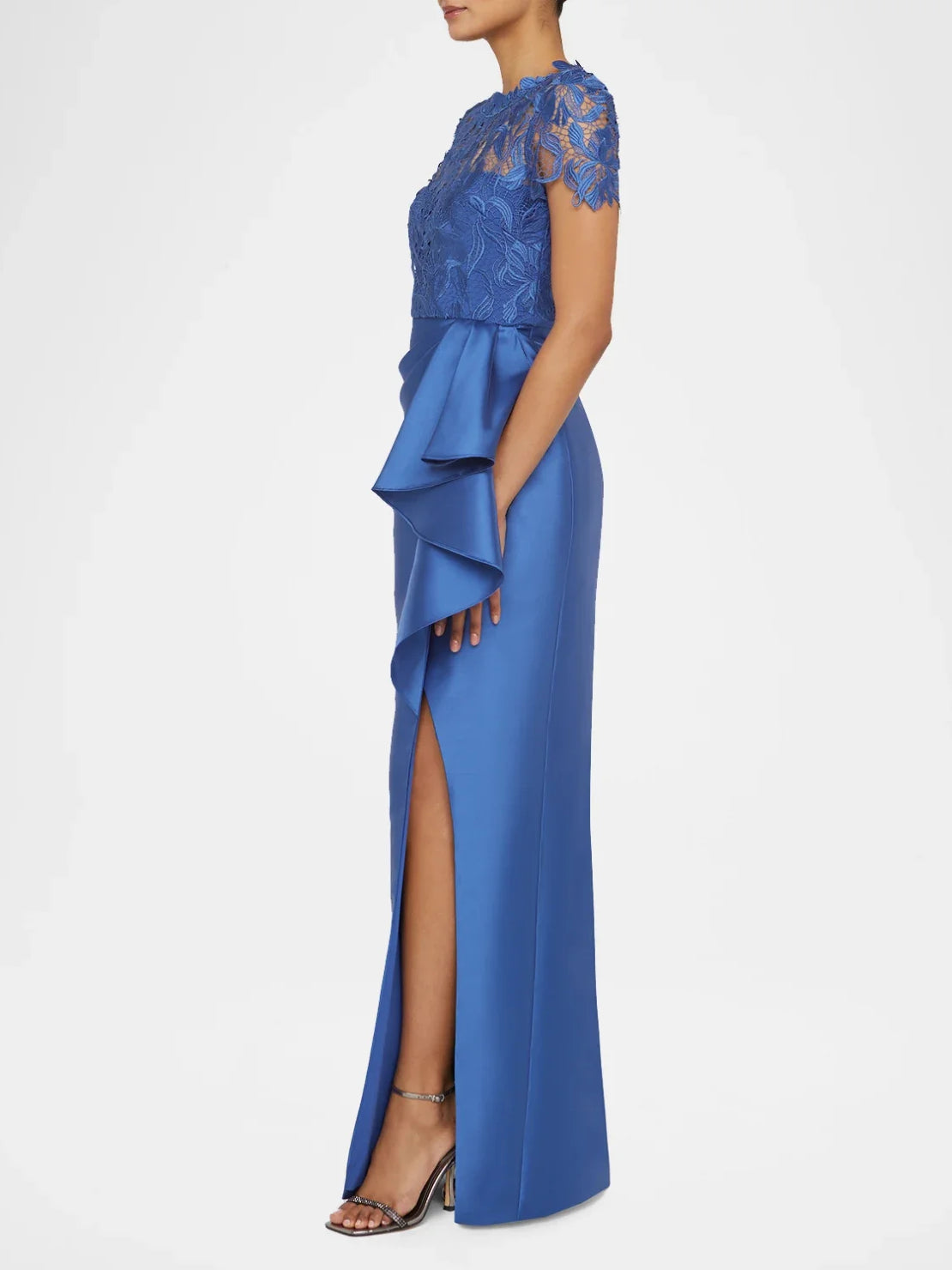Blue satin sheath dress with short lace sleeves, draped ruffles and front leg slit.