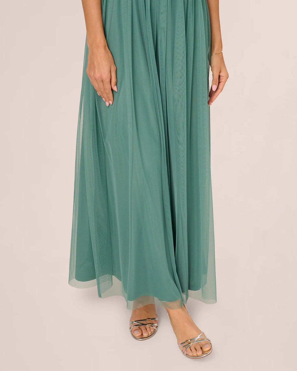 Seafoam green pleated A-line maxi skirt with sheer tulle overlay and lining