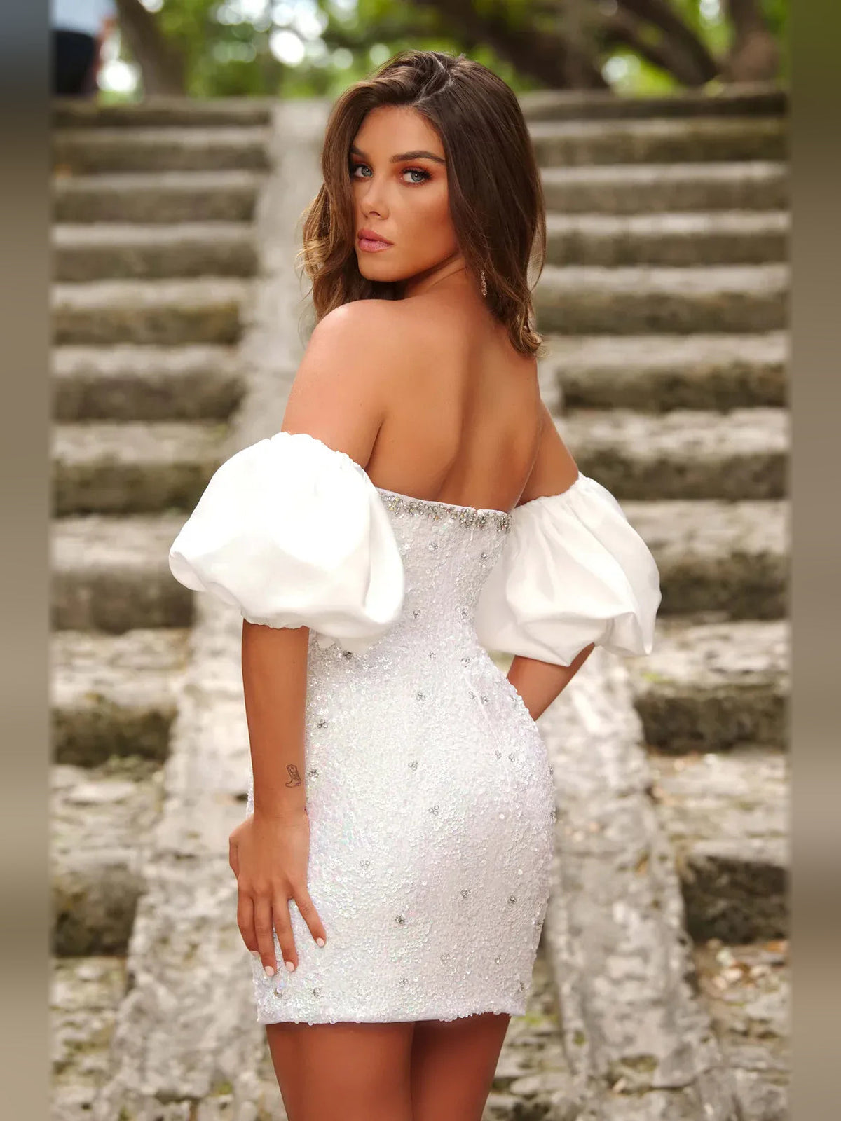 White strapless bodycon mini dress with sparkle sequin bodice and off-shoulder puff sleeves