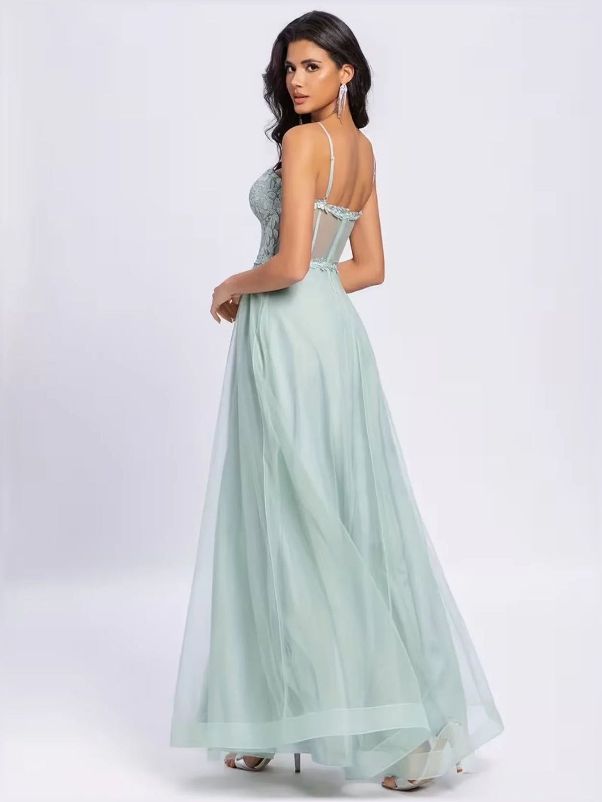 Mint green thin-strap formal dress with lace bodice and flowing floor-length skirt