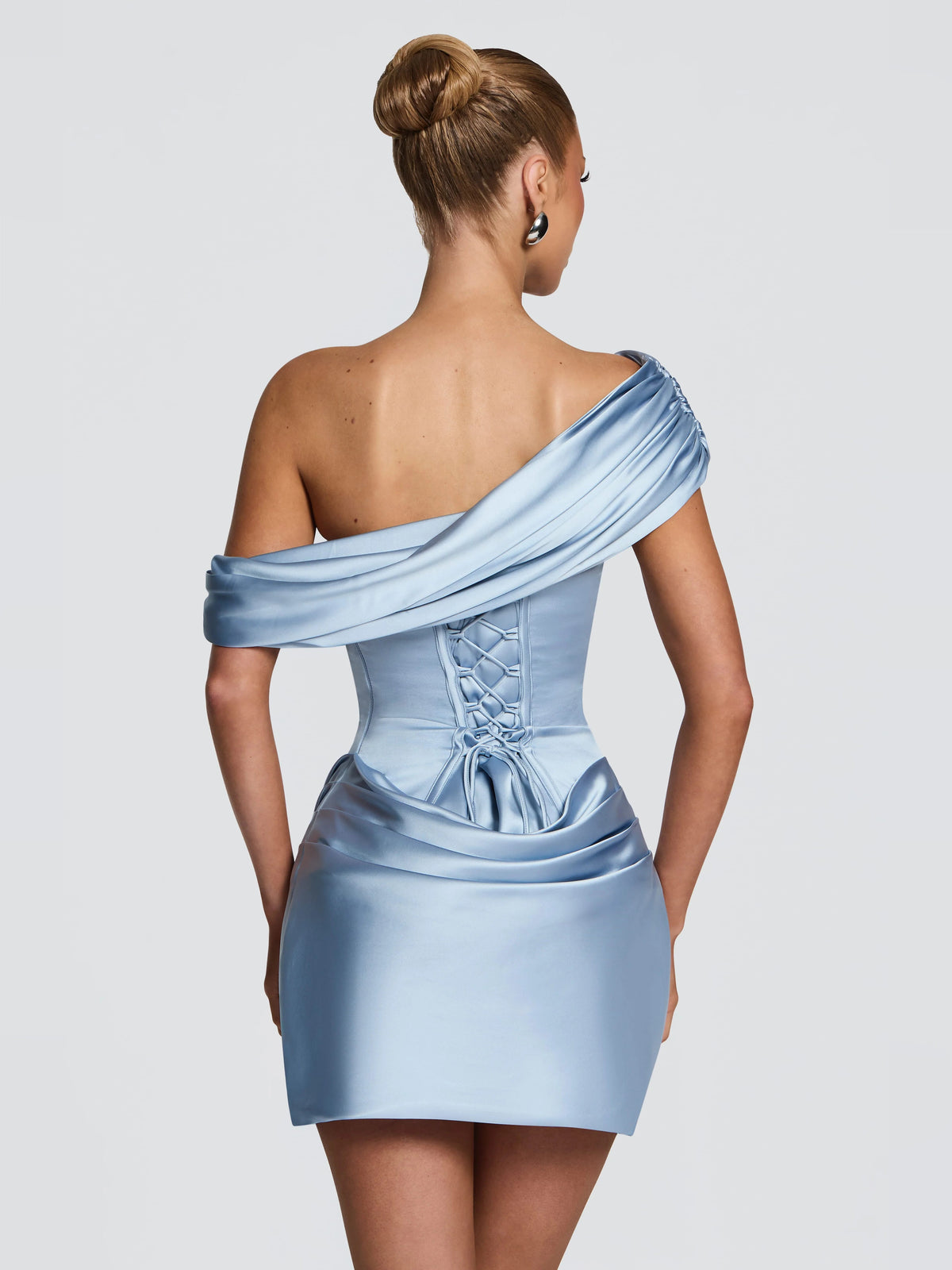 Blue satin one-shoulder mini dress with lace-up corset back and draped hip