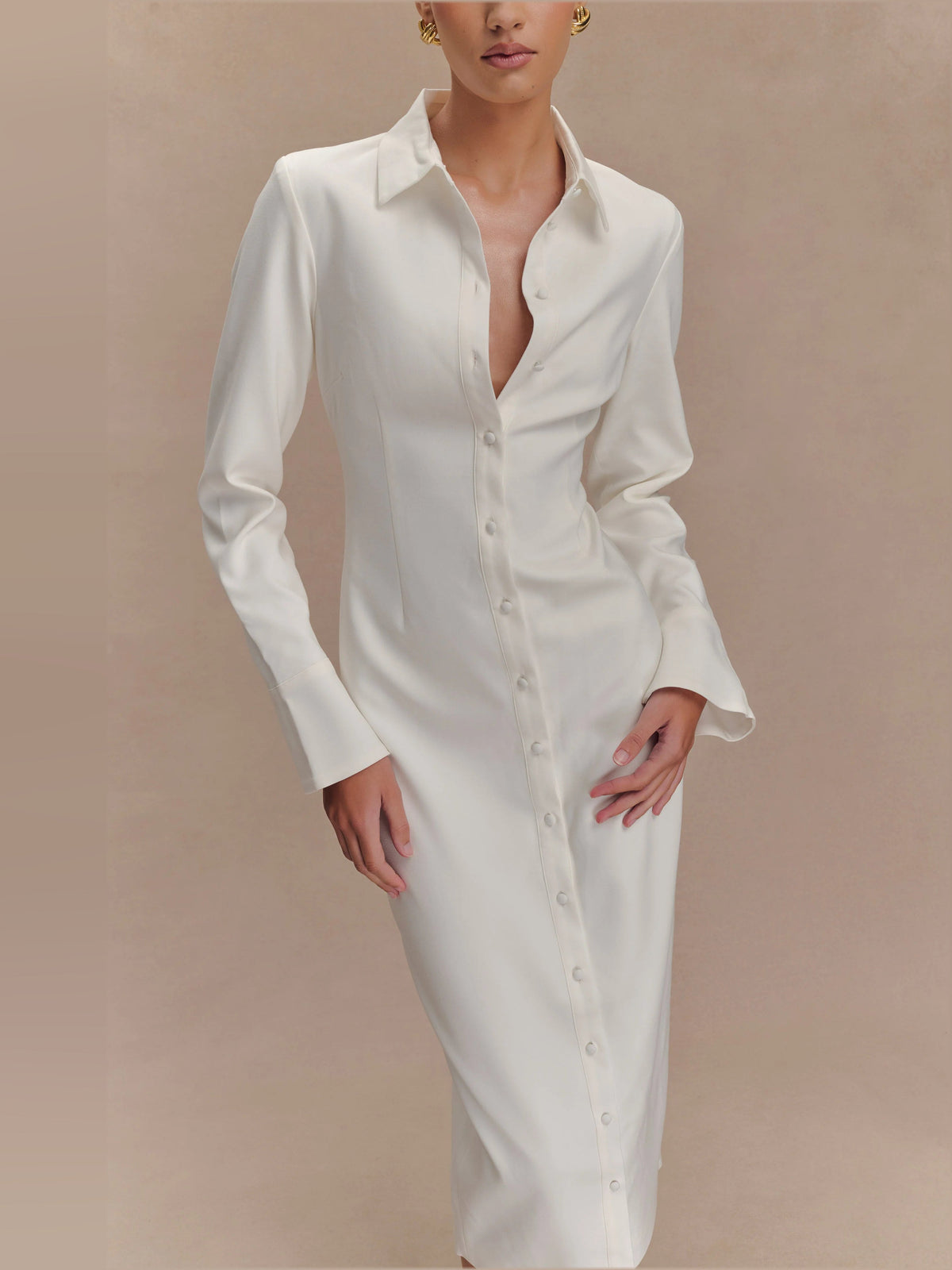 White fitted midi shirt dress close-up with pointed collar and button placket