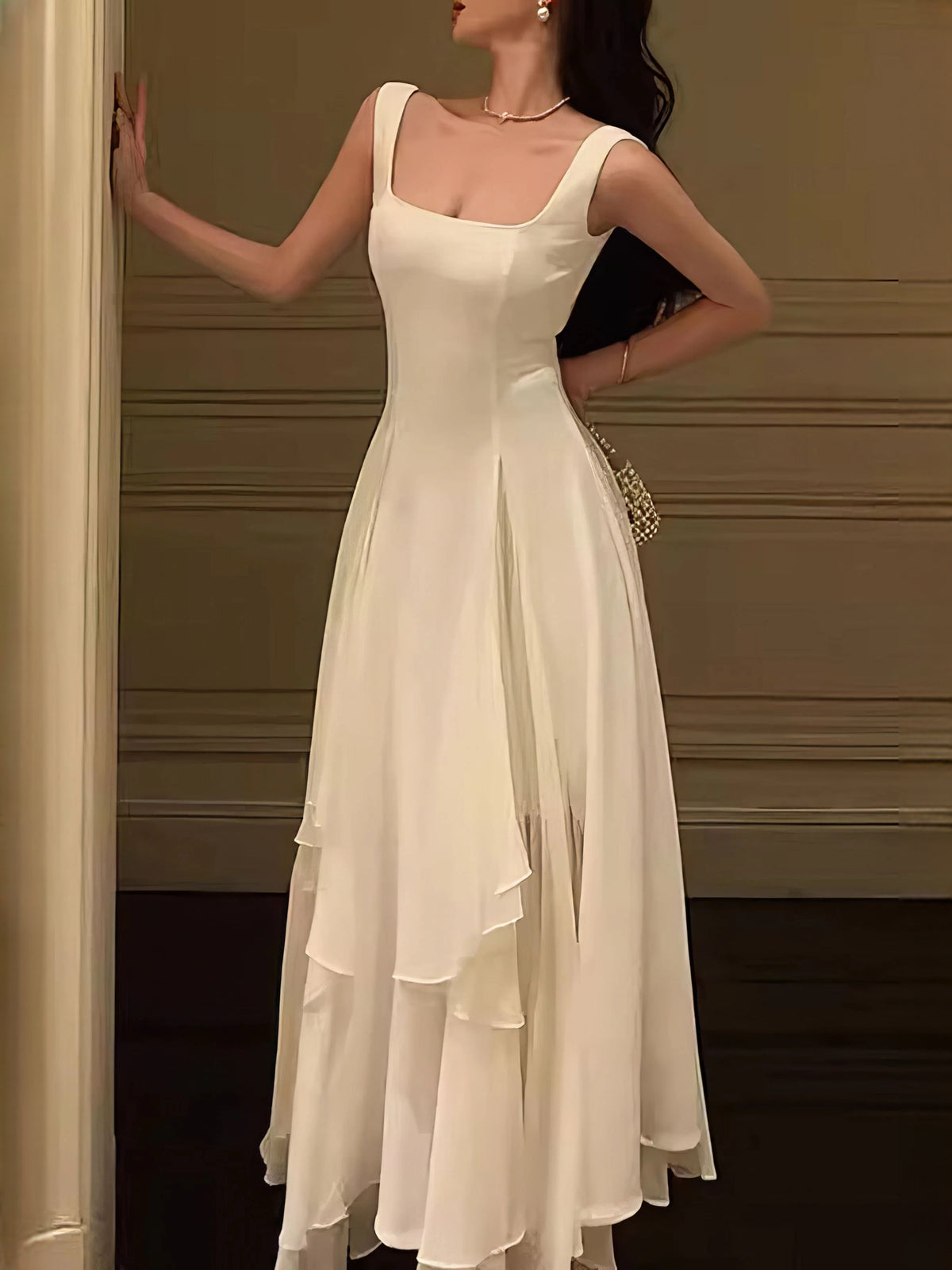Ivory sleeveless square-neck A-line wedding dress with tiered layered skirt, back view