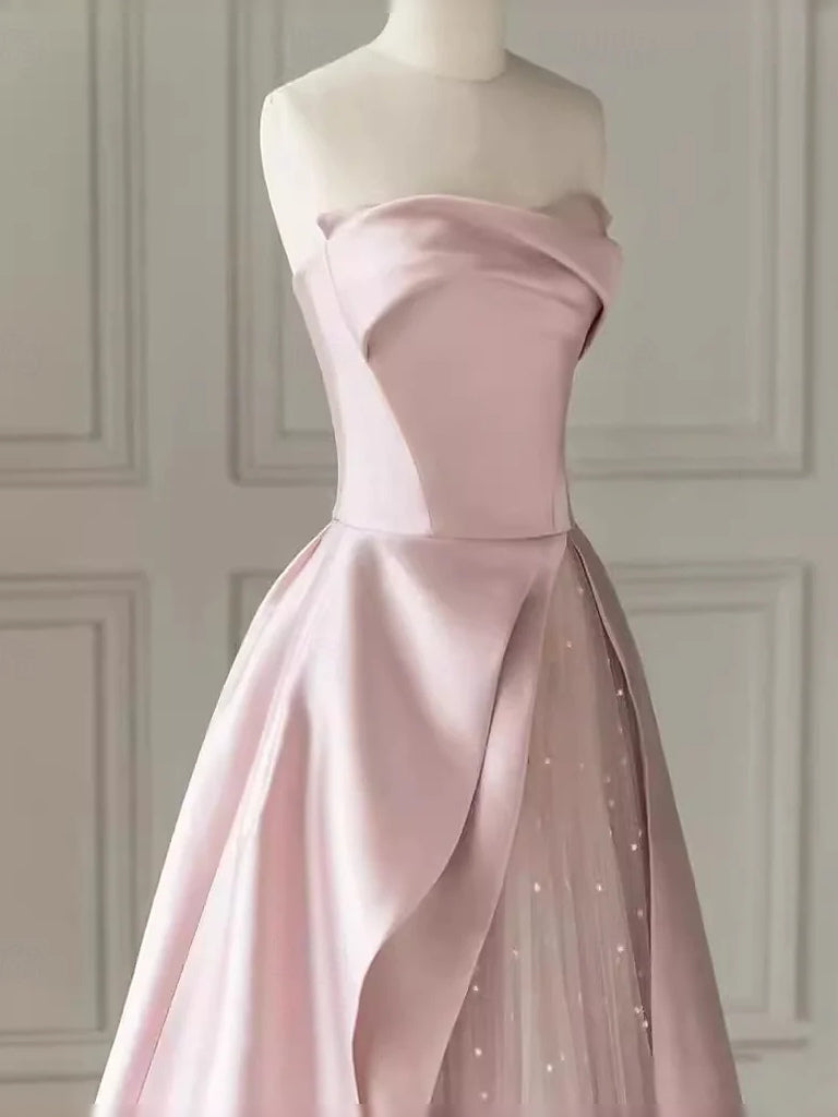 Blush pink sweetheart satin bodice with draped waist and shimmering glitter skirt panel