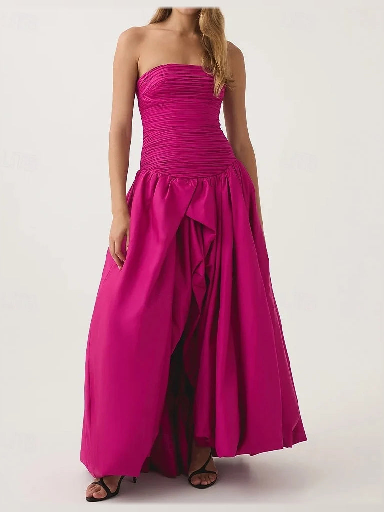 Hot pink strapless maxi prom dress with ruched bodice and tiered gathered skirt