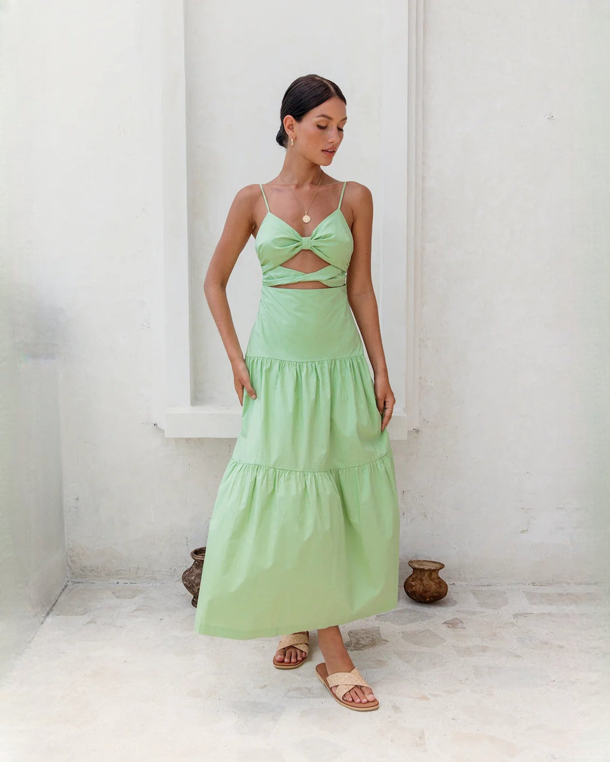 Light green sleeveless tiered maxi dress in A-line silhouette, side view