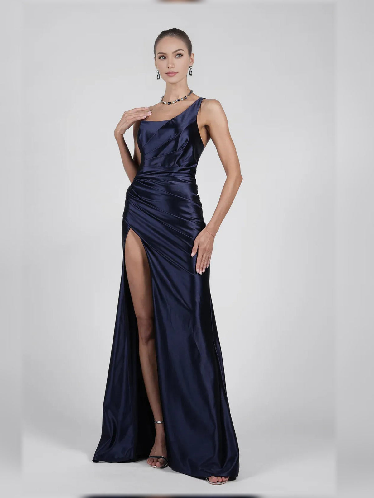 Navy one-shoulder sleek formal dress with ruched bodice and high side slit