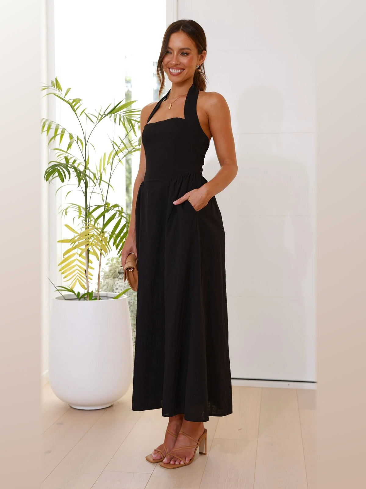Black midi formal dress, alternate full-length view showing the skirt