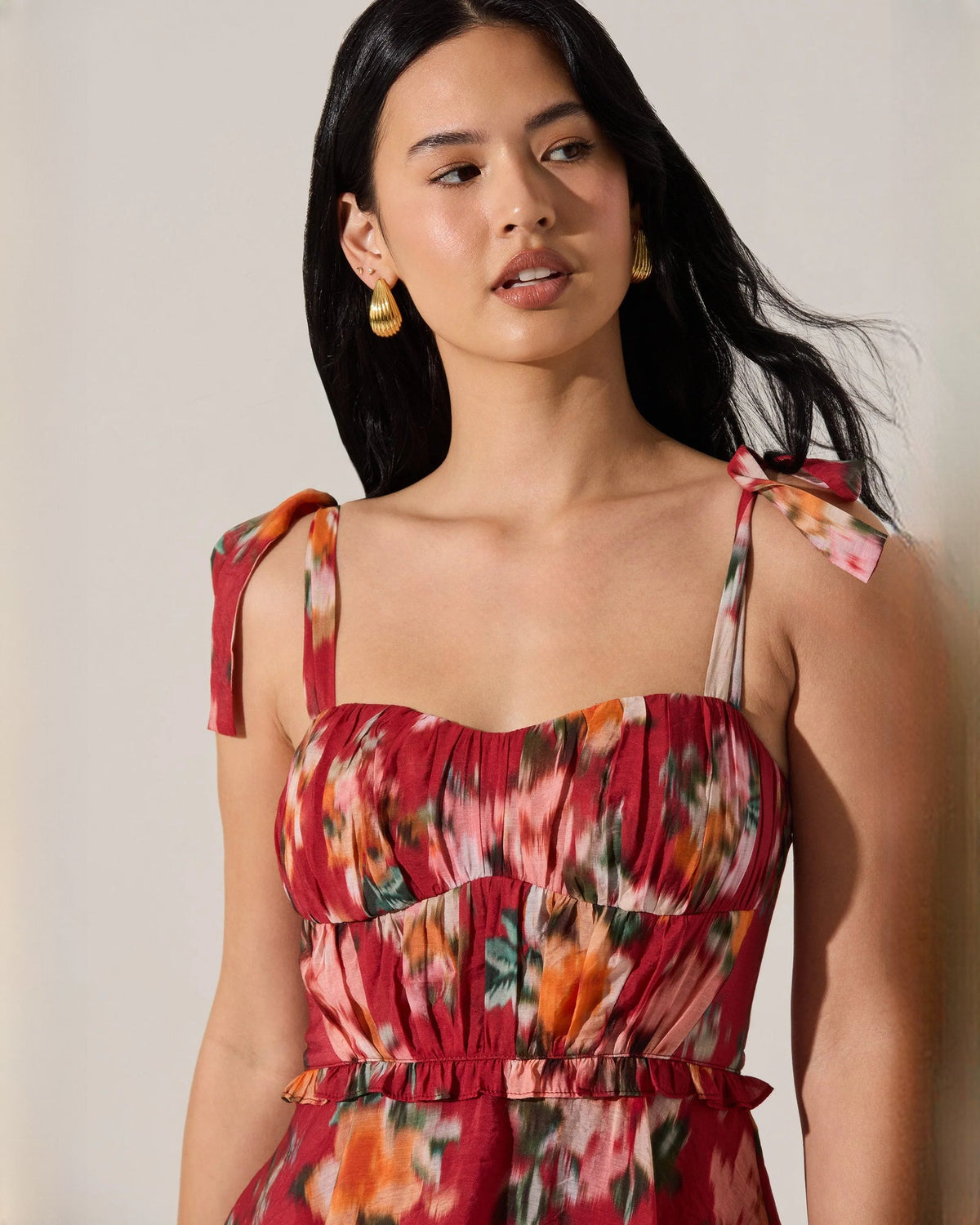 Red floral sweetheart maxi dress with smocked bodice and bow tie shoulder straps
