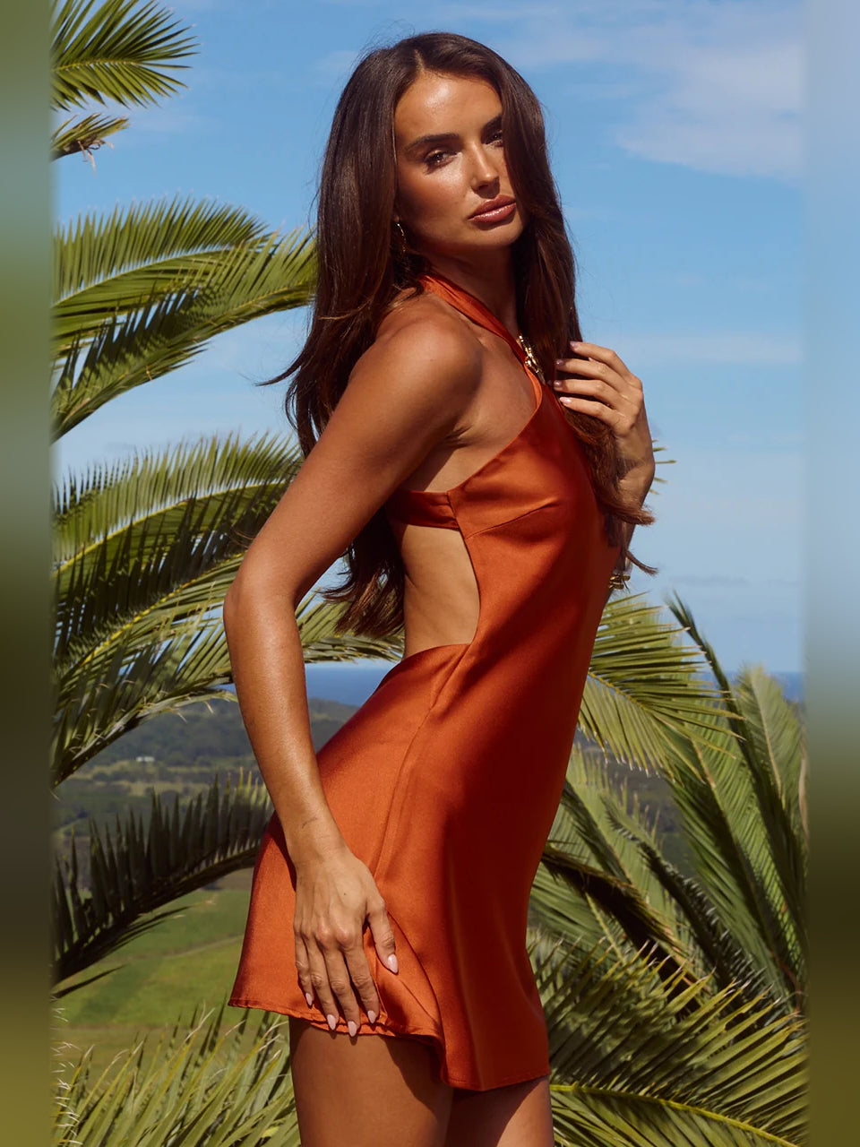Rust one-shoulder mini A-line dress with crisscross back strap detail