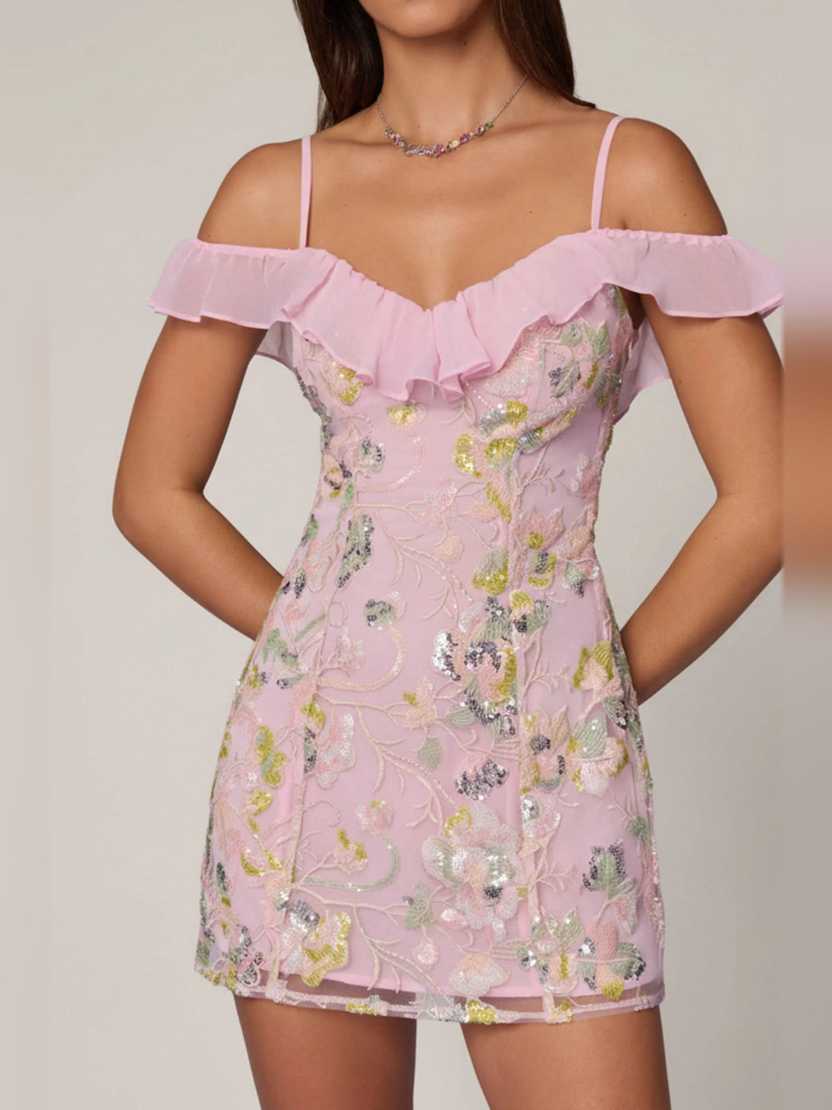Pink A-line mini dress with ruffled off-shoulder neckline and fitted bodice