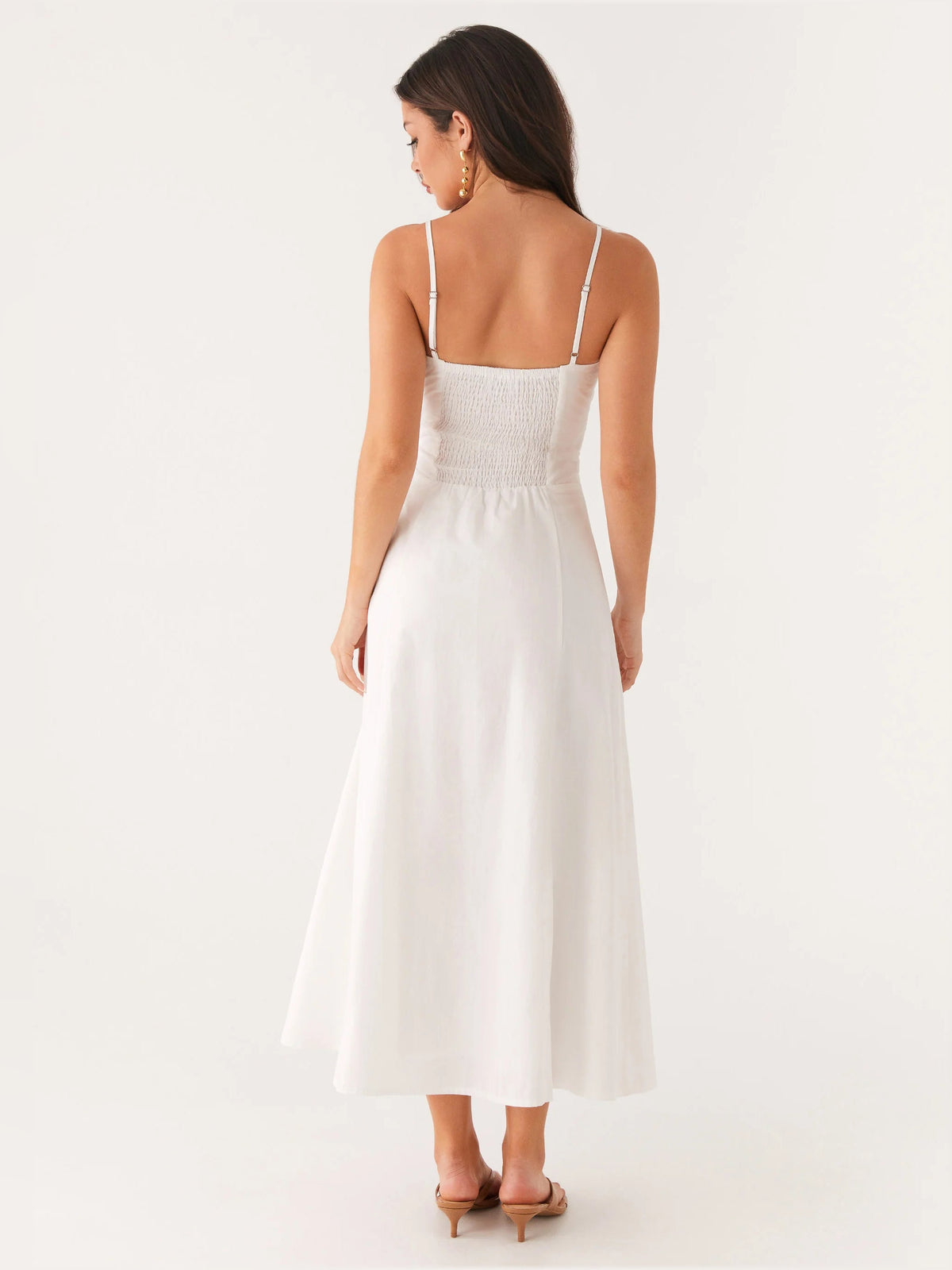 White midi formal dress, back view with spaghetti straps and gathered waist