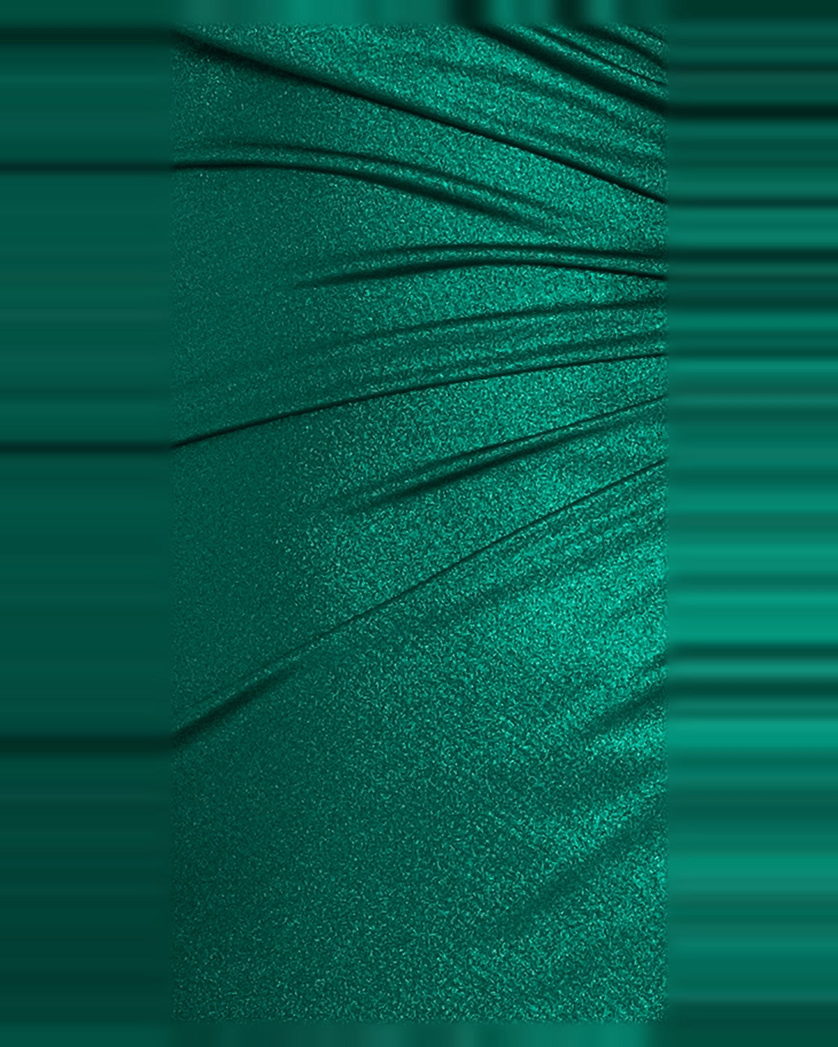 Close-up of emerald ruched satin-like fabric detail