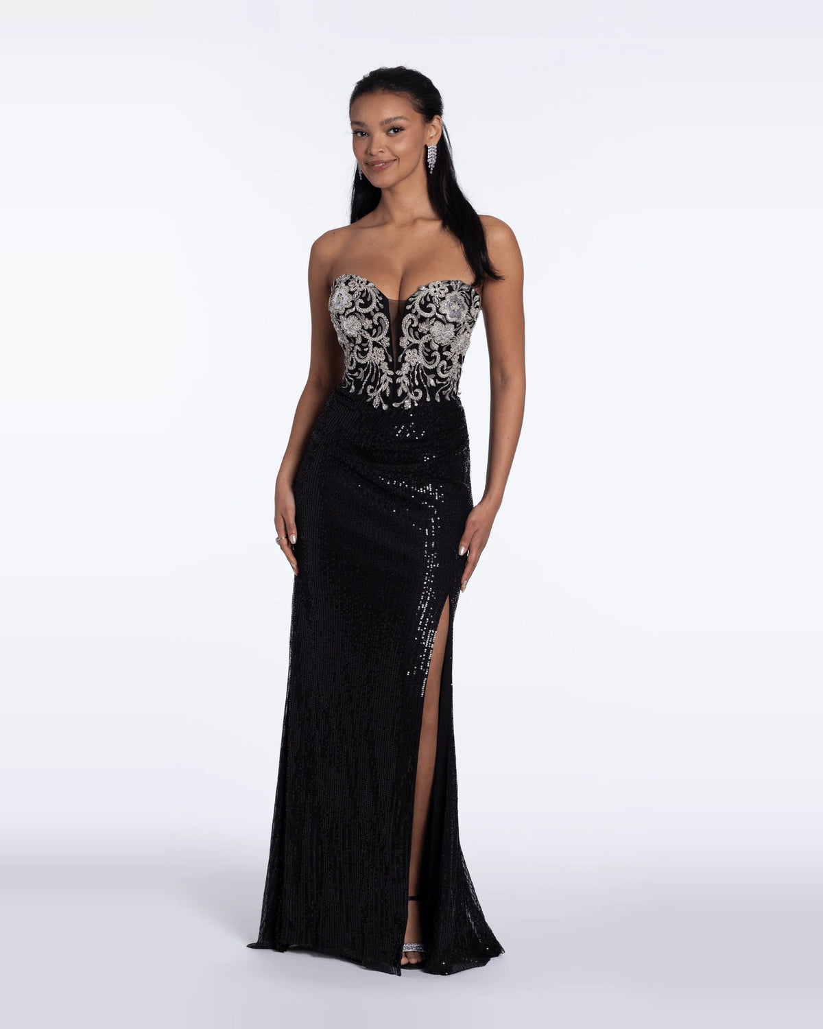 Black strapless column maxi prom dress with silver patterned bodice and thigh slit.