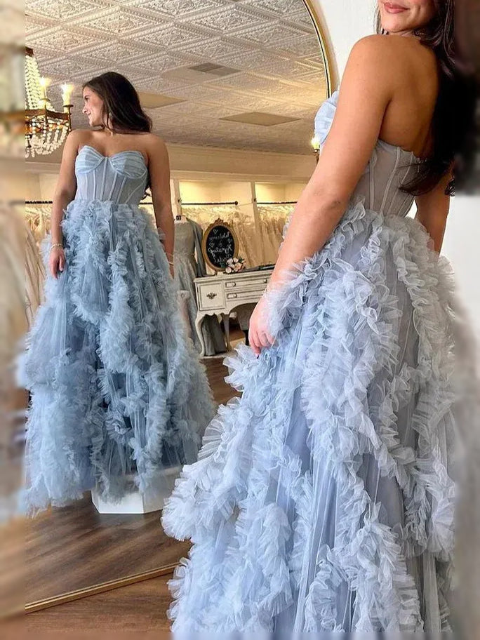 Dusty blue corset prom dress with ruffled tulle skirt and thigh-high slit