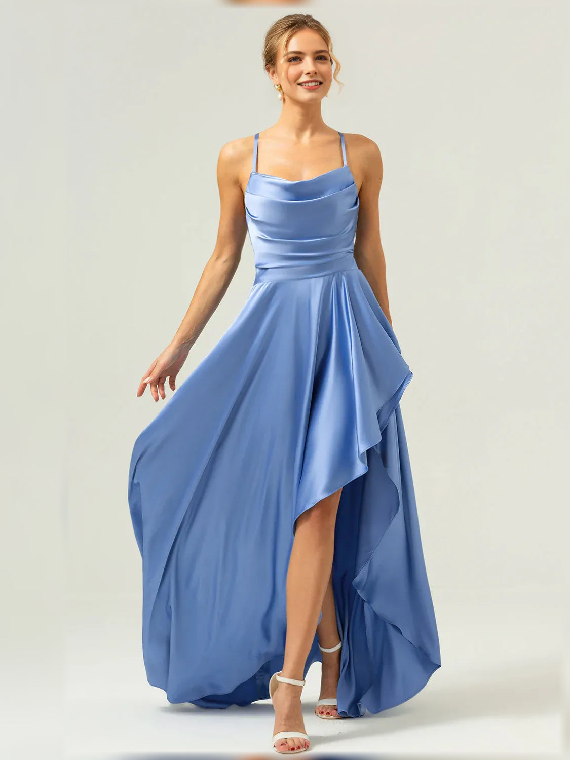 Blue formal satin maxi dress with spaghetti straps and asymmetrical ruffle overlay hem