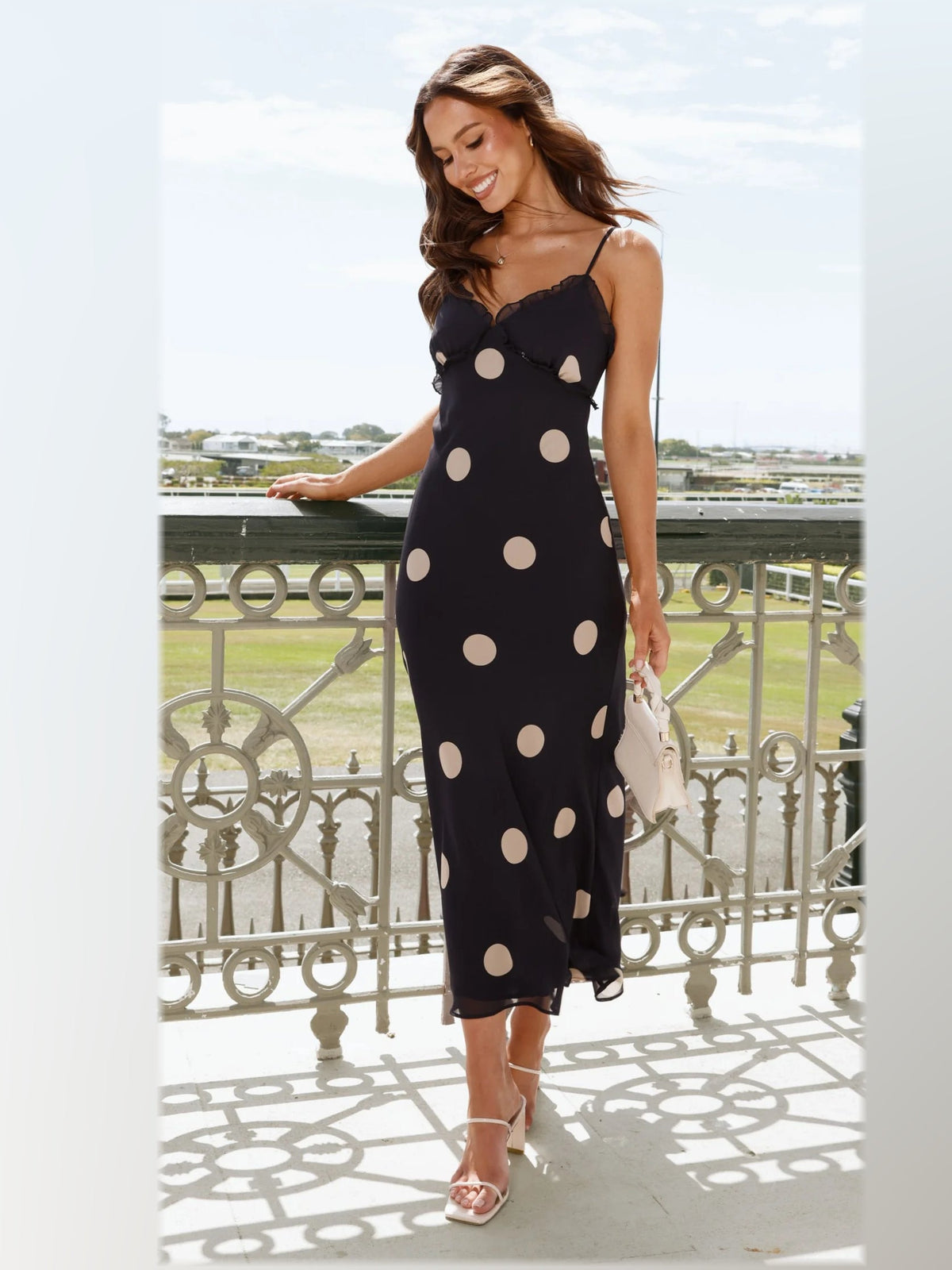Black maxi formal dress, alternate full-length view showing the skirt