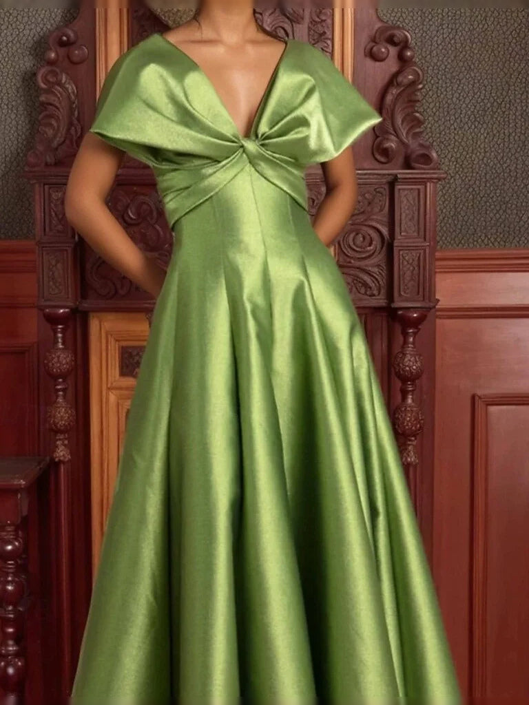 Green satin V-neck prom dress with draped waist bow and full skirt