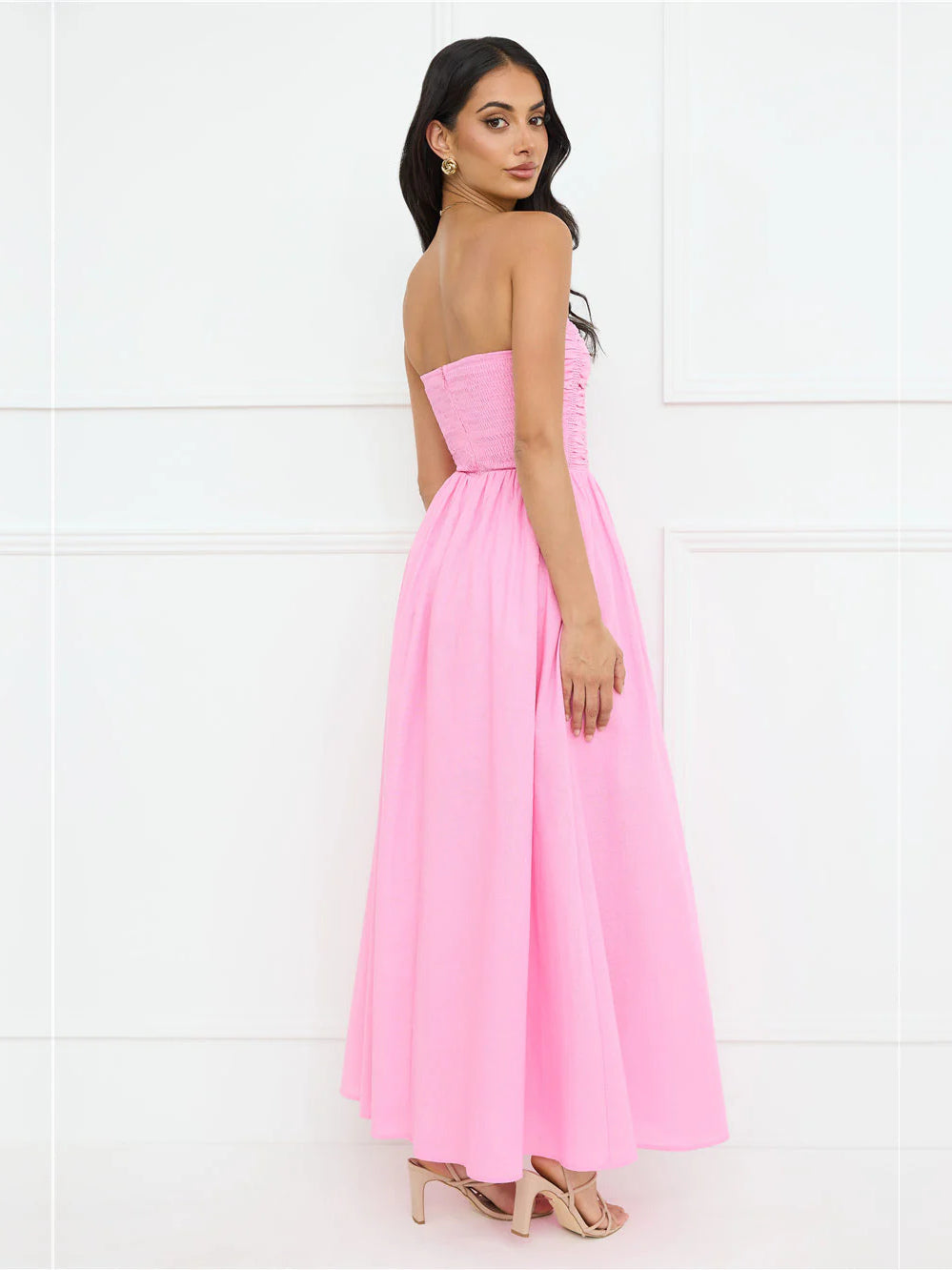 Pink strapless A-line maxi dress with ruched bodice, side view