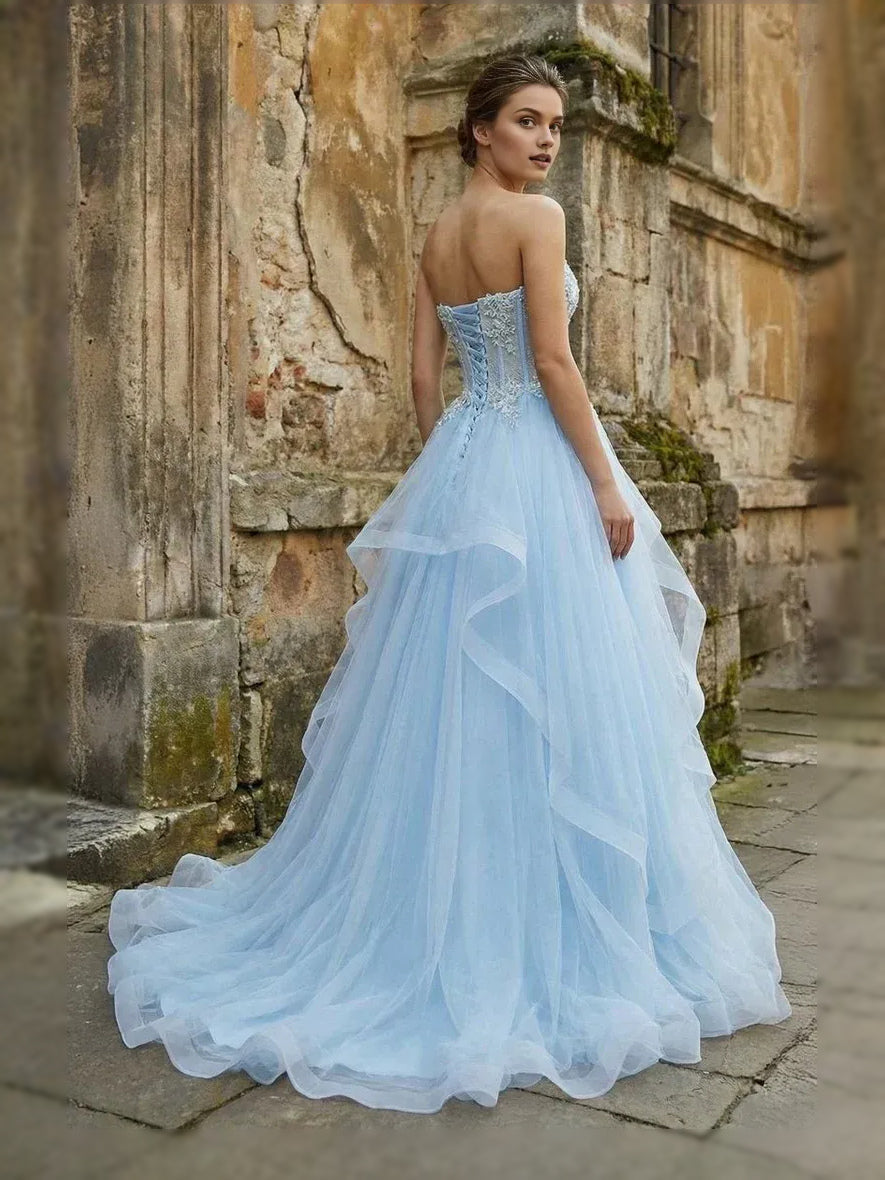 Light blue strapless corset ball gown with layered tulle skirt and sweetheart bodice