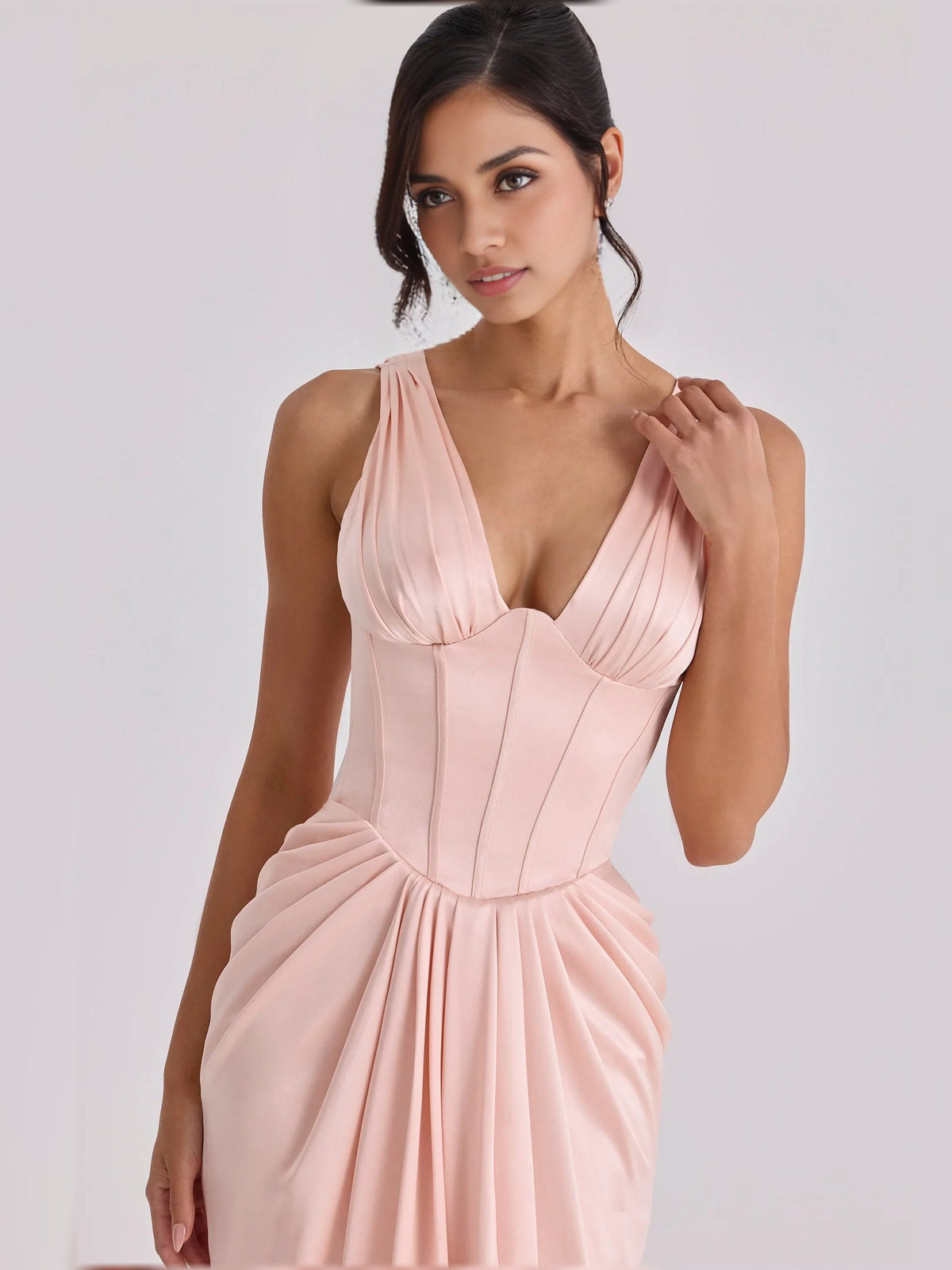 Blush pink v-neck corset pleated floor-length formal dress, close-up of bodice