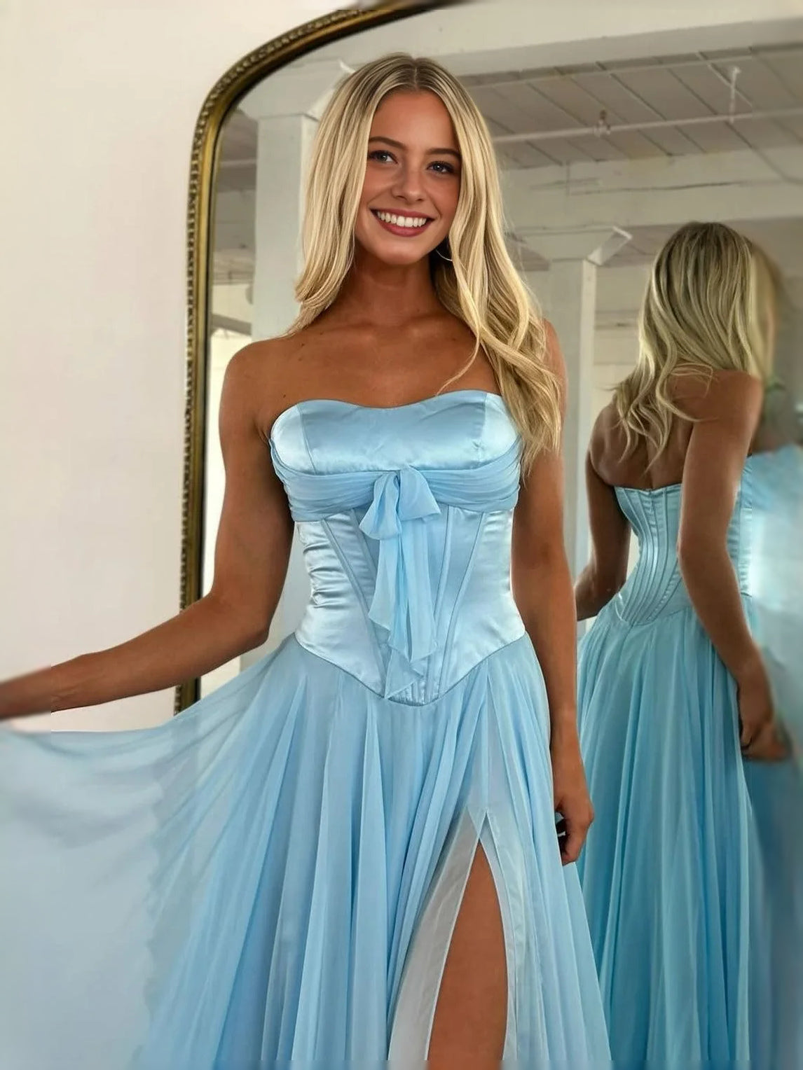 Light blue strapless corset prom dress with bow top and front leg slit