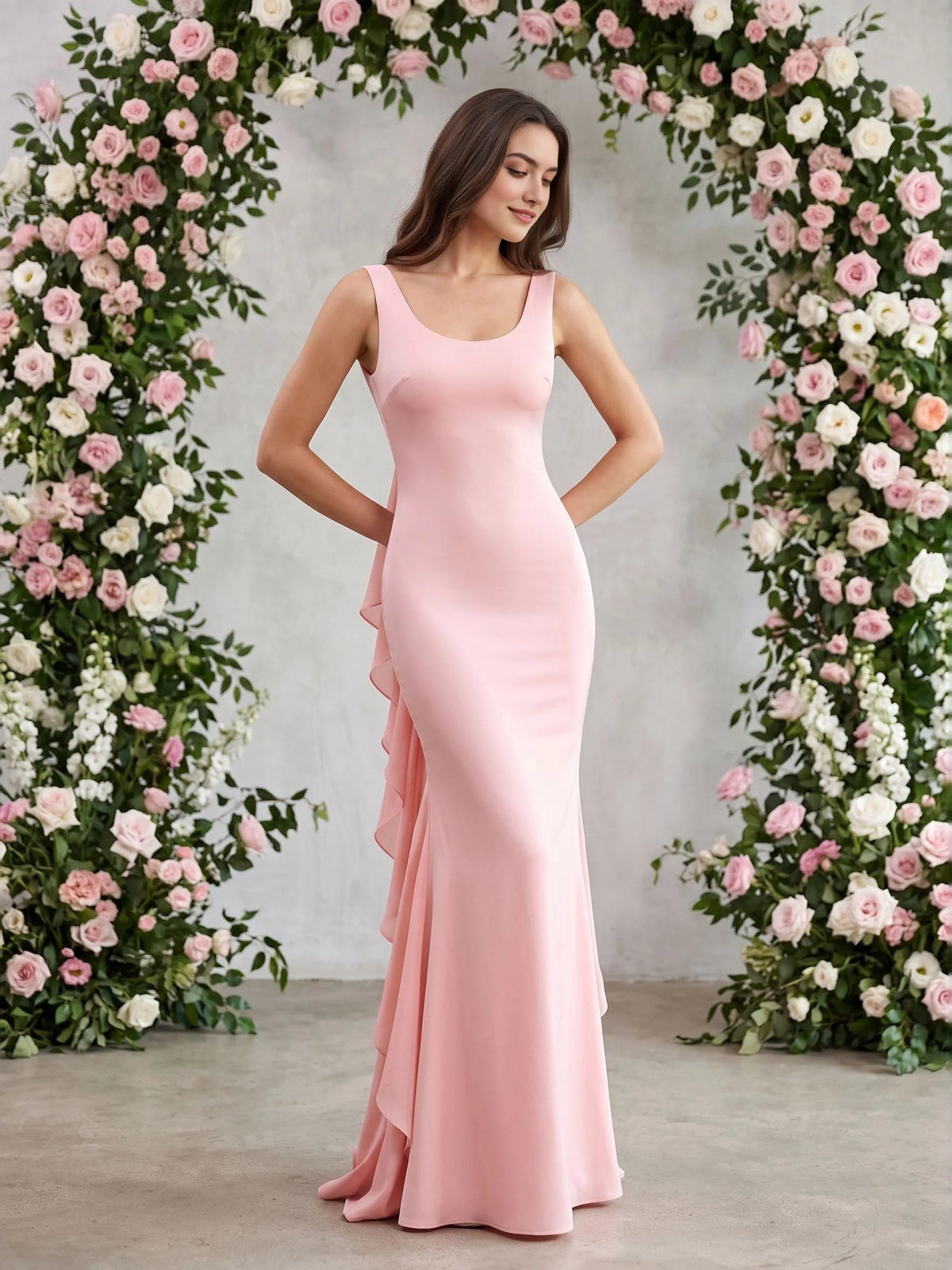 Blush pink satin mermaid gown with scoop neck and layered ruffle front detail