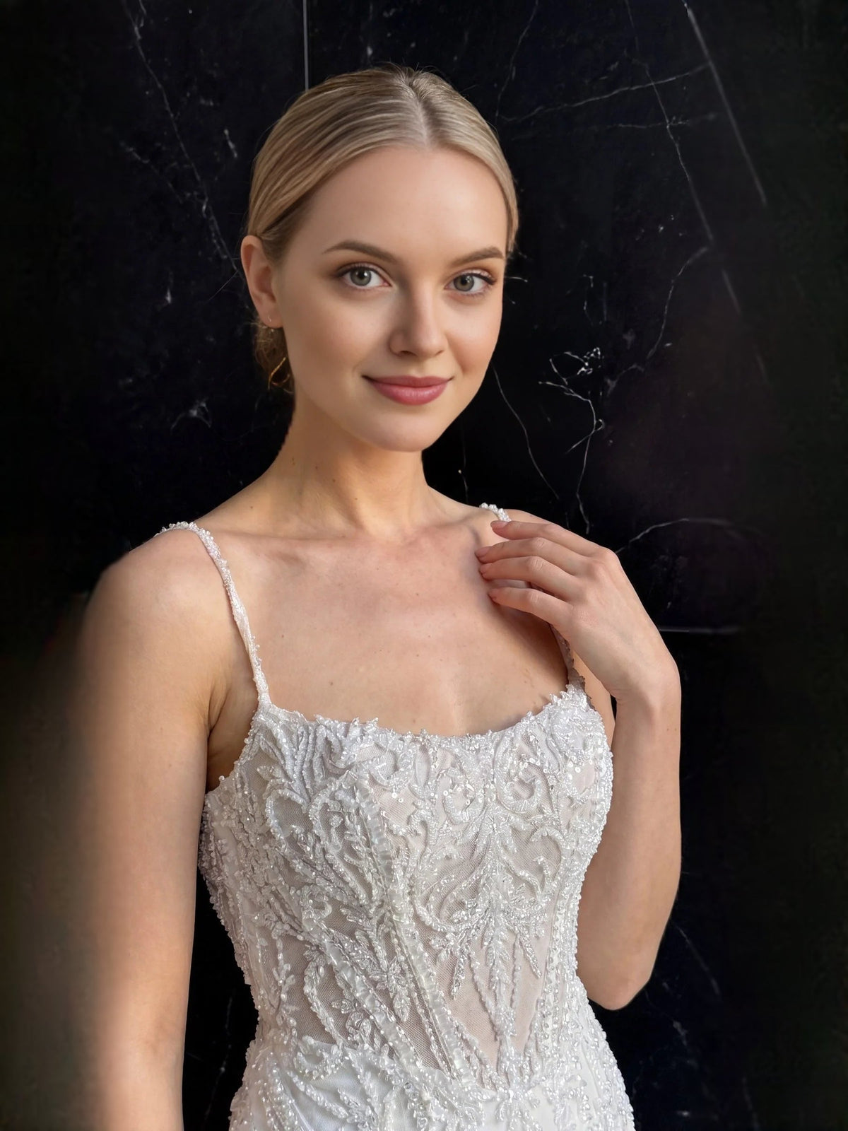 Ivory beaded sweetheart bodice with thin spaghetti straps and detailed lace texture