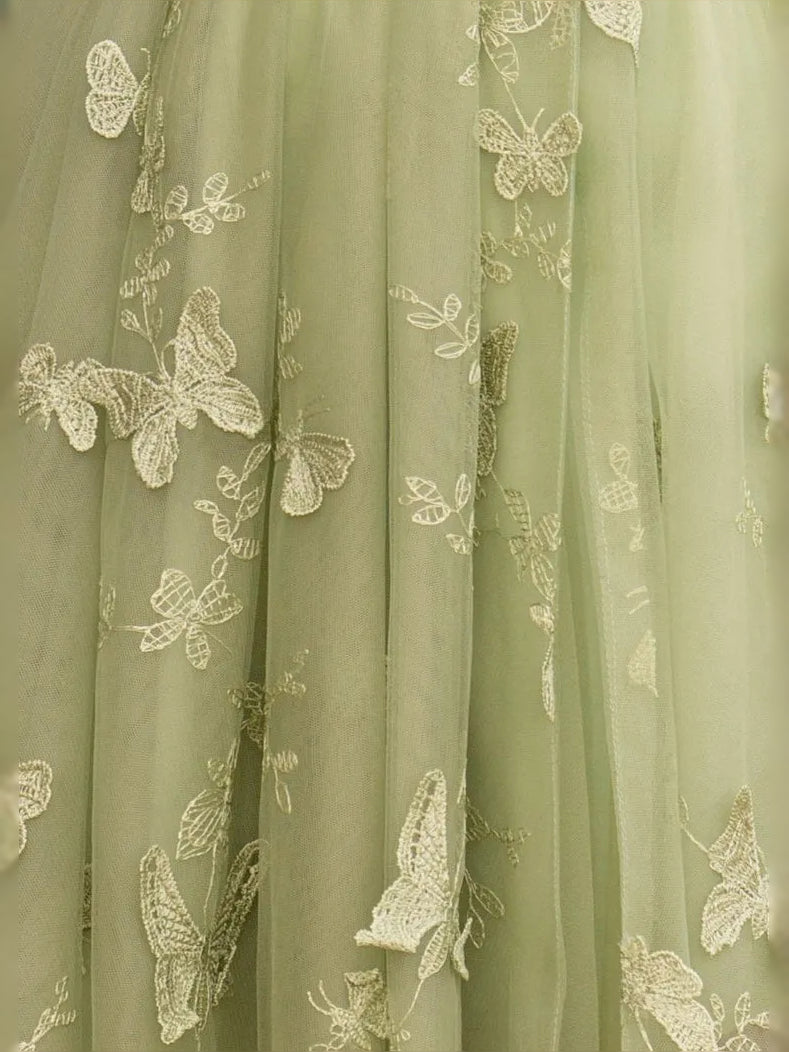 Sage green tulle fabric with raised butterfly and floral embroidery pattern