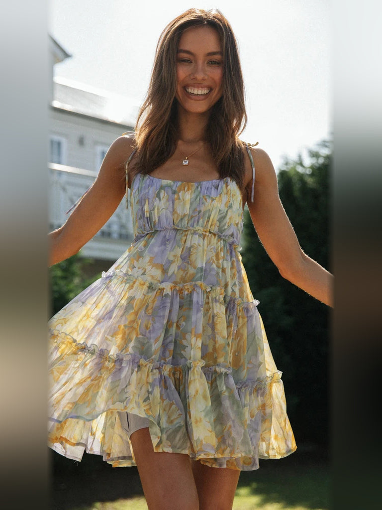 Floral tiered mini dress with spaghetti straps and tiered ruffle skirt