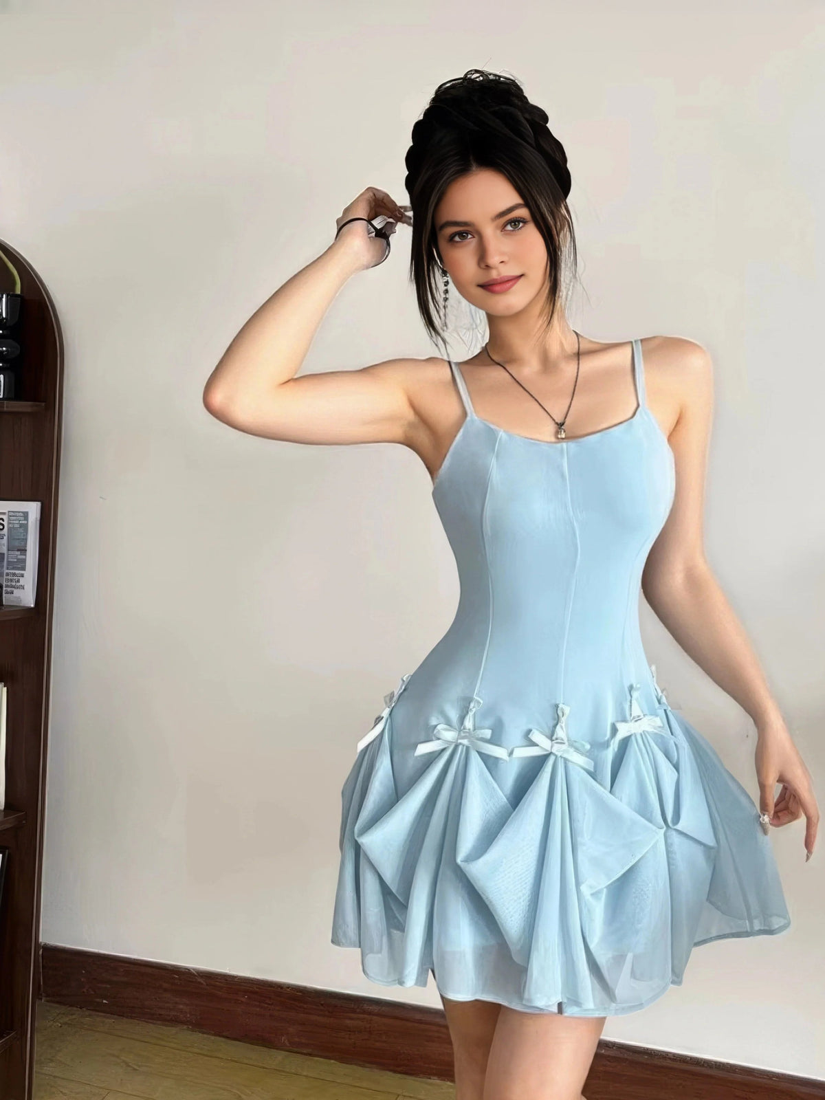 Light blue A-line maxi prom dress with scoop neck, thin straps, bow appliques at skirt
